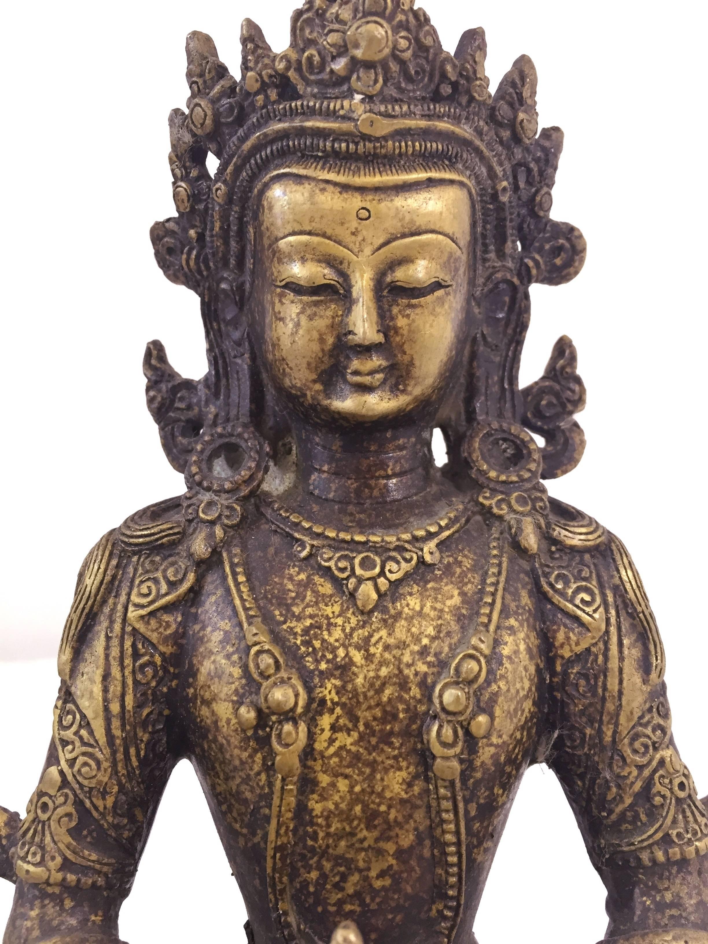 The Tara is the Goddess of compassion. She is widely believed to come to a person's aid when in need, grants wishes and brings blessings. This fine piece depicts the Tibetan Tara seated on lotus throne holding a bottle of wisdom nectar. Her bodice