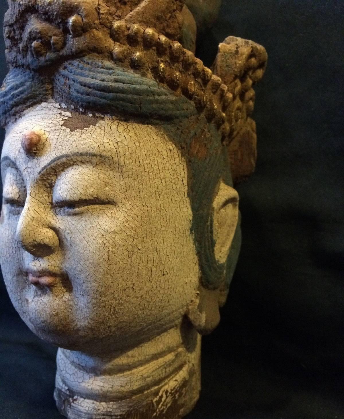 A hand-carved, hand-painted wooden Kwan Yin on a solid marble base. 

The statue is beautifully carved with vivid expressions. The Bodhisattva's facial features are well defined. 

Kwan Yin is the Goddess of Compassion. She brings blessings and