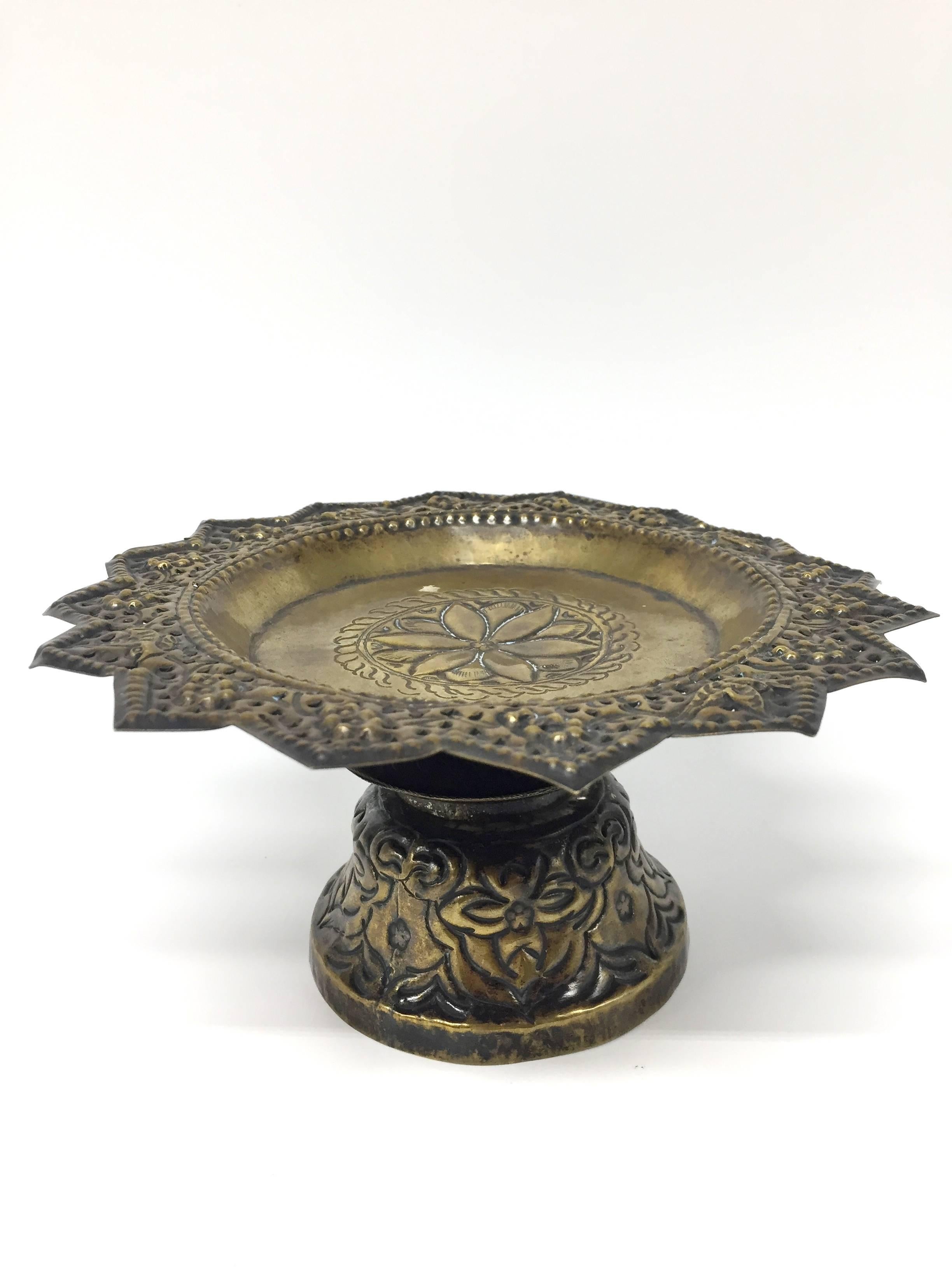 This type of dish is used on the Tibetan Altar to hold offerings such as cakes, candies and small fruits. The dish itself is very finely done with an overall lotus pattern and pierced 