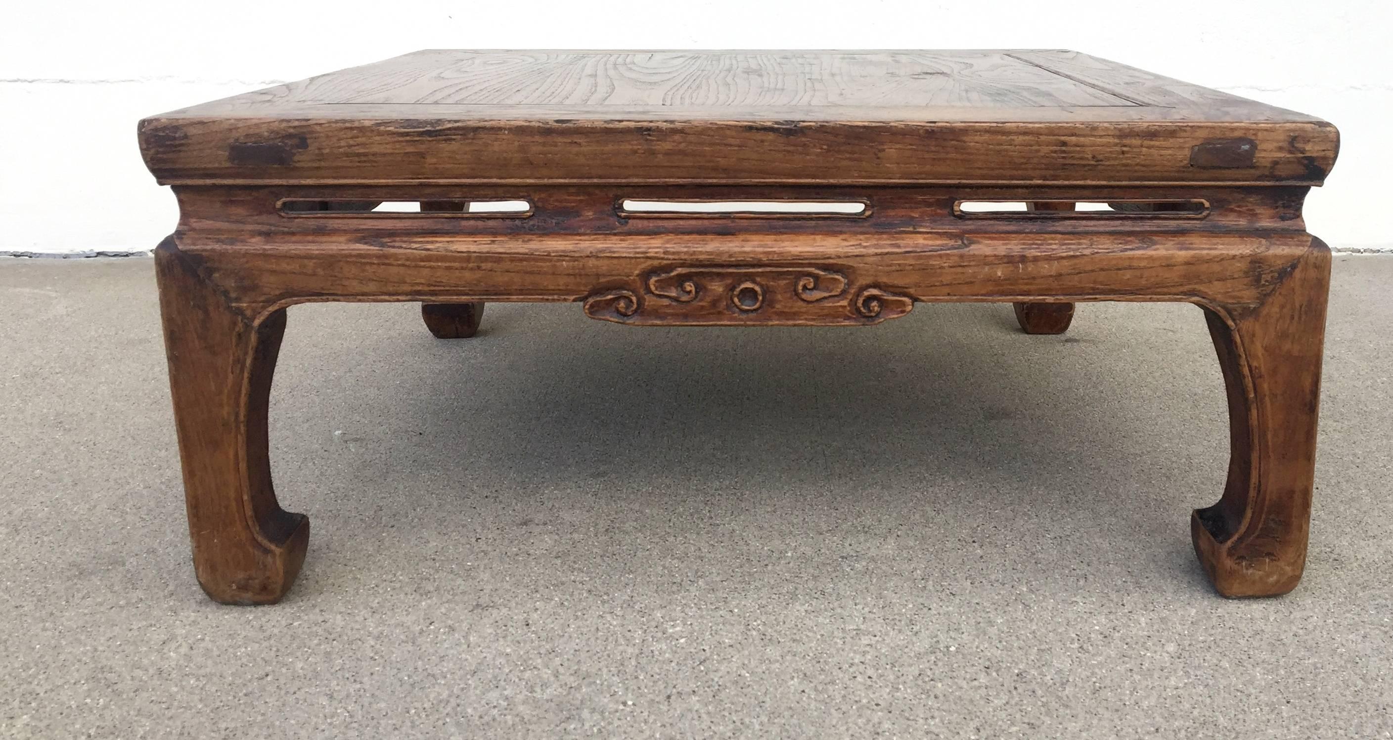 Beautiful 19th century Chinese table in solidwood. Such a piece is used in northern China on a structure called "Kang", a platform brick bed that is heated from underneath. In the extreme northern winters, kang, is the place where most
