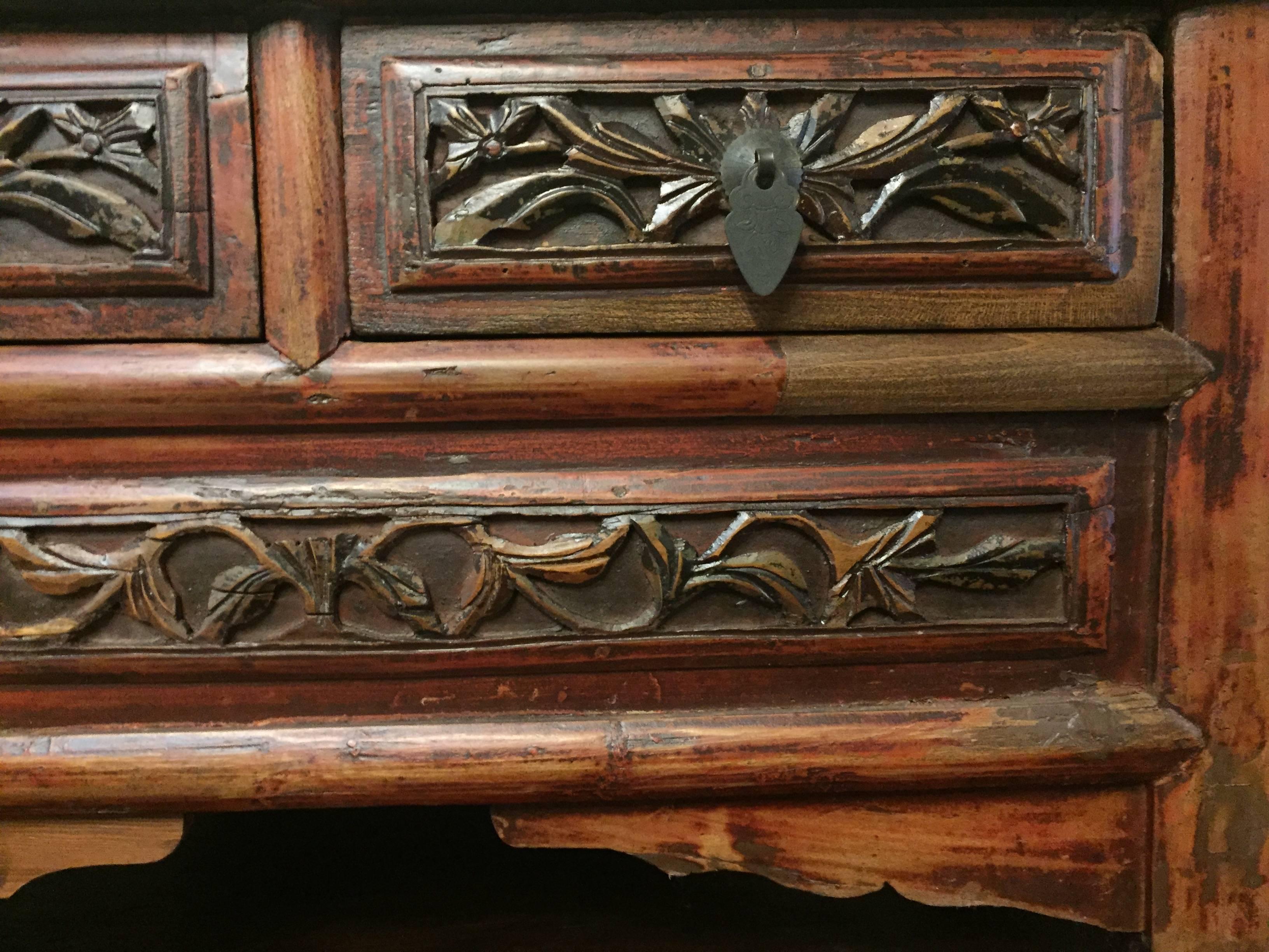 This wonderful low chest is the perfect table for your meditation room, excellent as a stand for a sculpture, books, towels and etc. It is also a great bench.

Beautiful solid wood makes the chest. Rustic, artistic carvings enhance its charm. Two