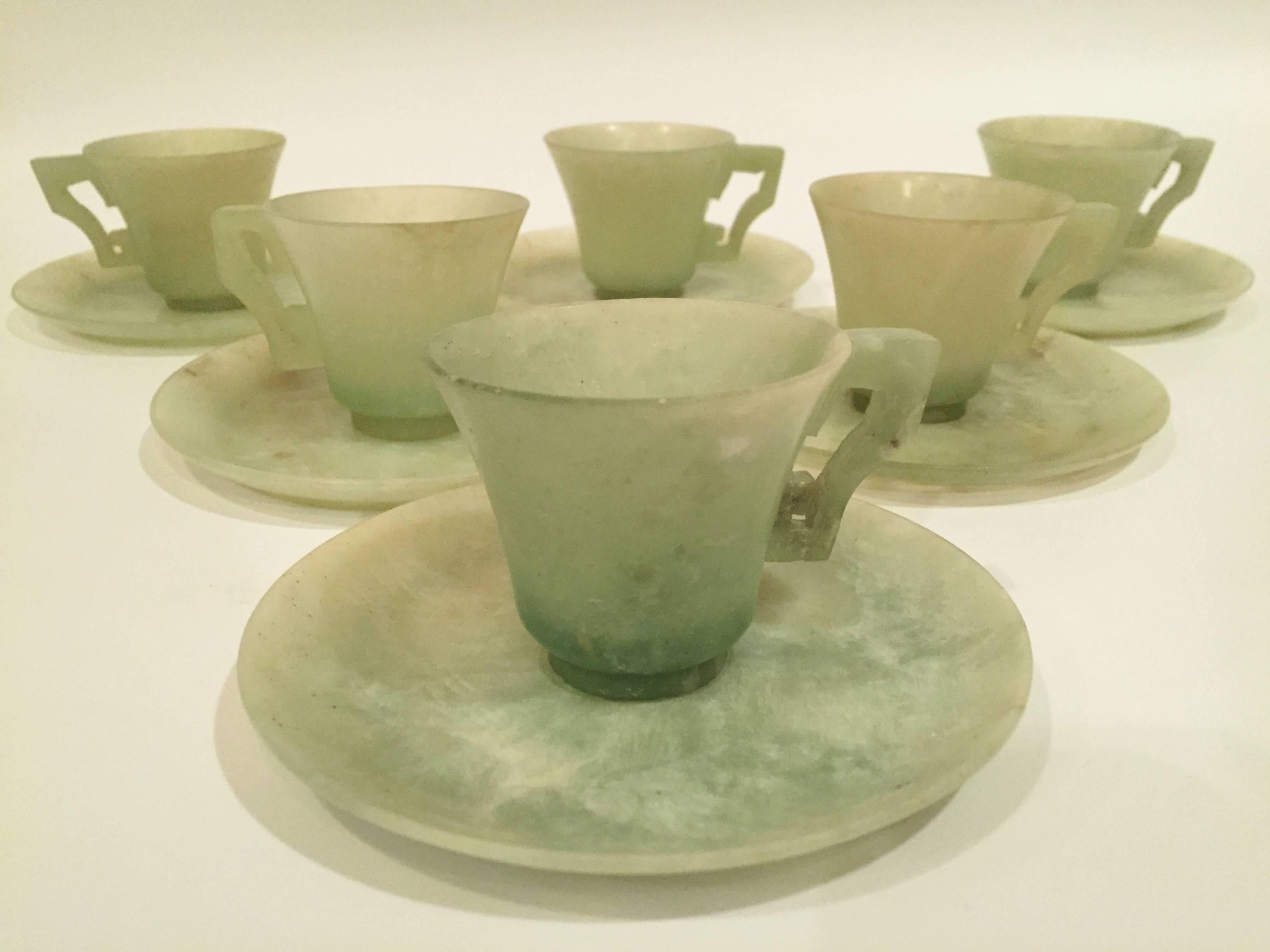 Exquisite fine jade antique cups and saucers. 12 original pieces in the set.

This is a rare find. 

In perfect condition. Made of the finest all natural green jade.

Saucers: 4.75