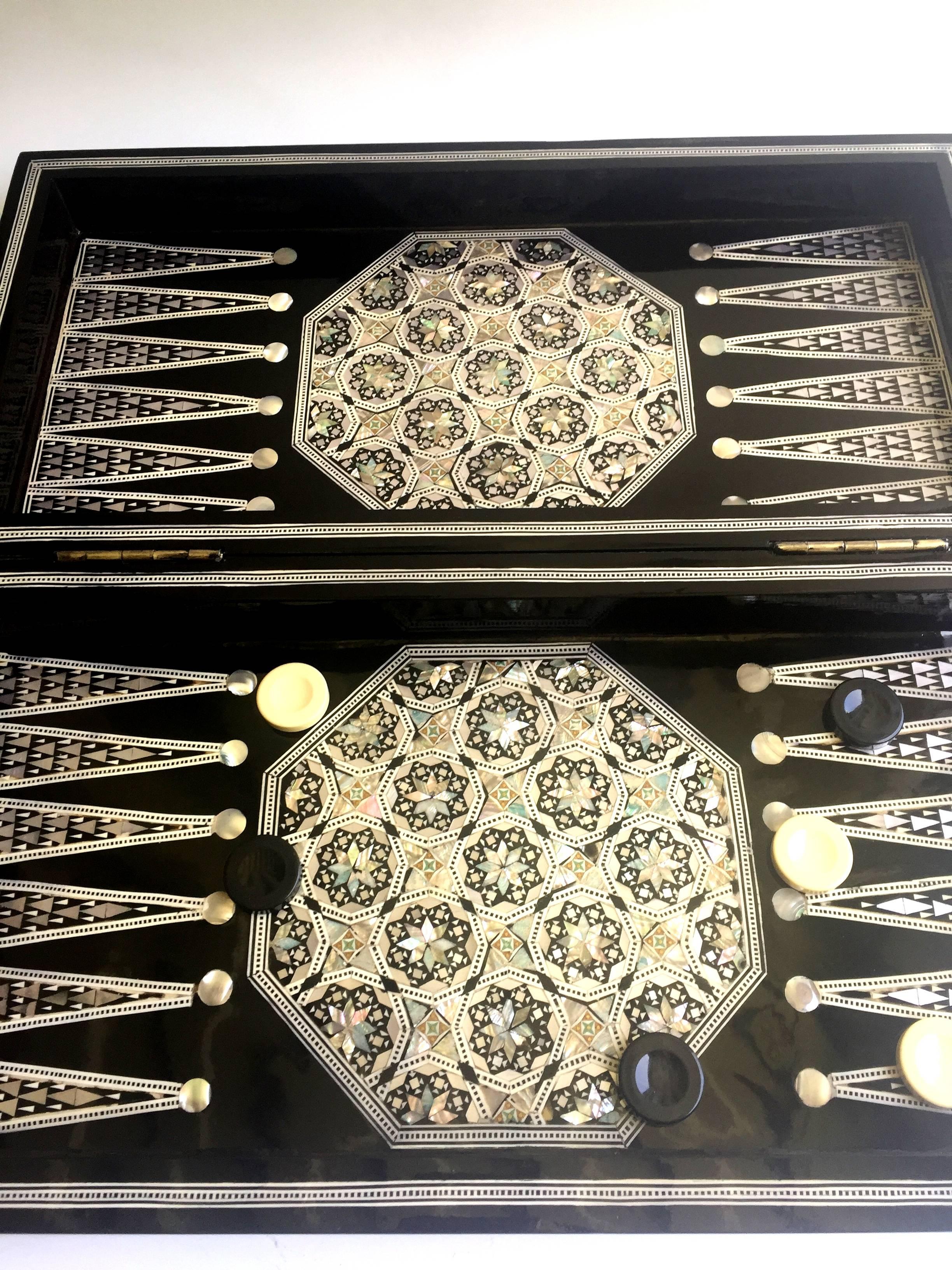 This is a double purpose game set which consists of both backgammon and chess. The craftsmanship on this beautiful piece is amazing. The wood box is entirely encrusted in genuine mother-of-pearl. The intricate pattern and Fine precision makes it a