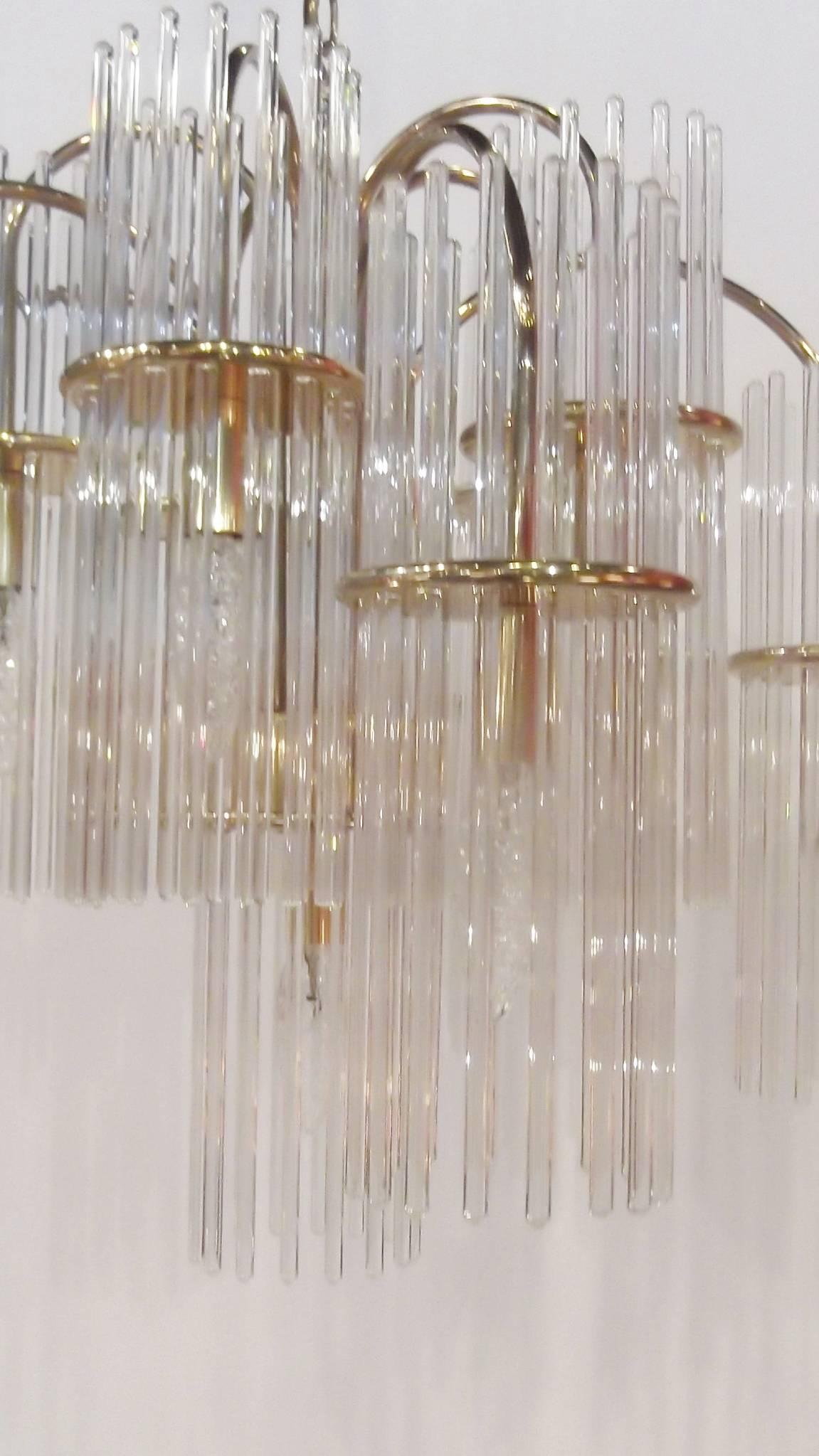 Gaetano Sciolari chandelier for lightolier. This is a classic glass rod hanging fixture with brass arms. A total of 11 lights. This chandelier is very balanced and all in excellent condition.