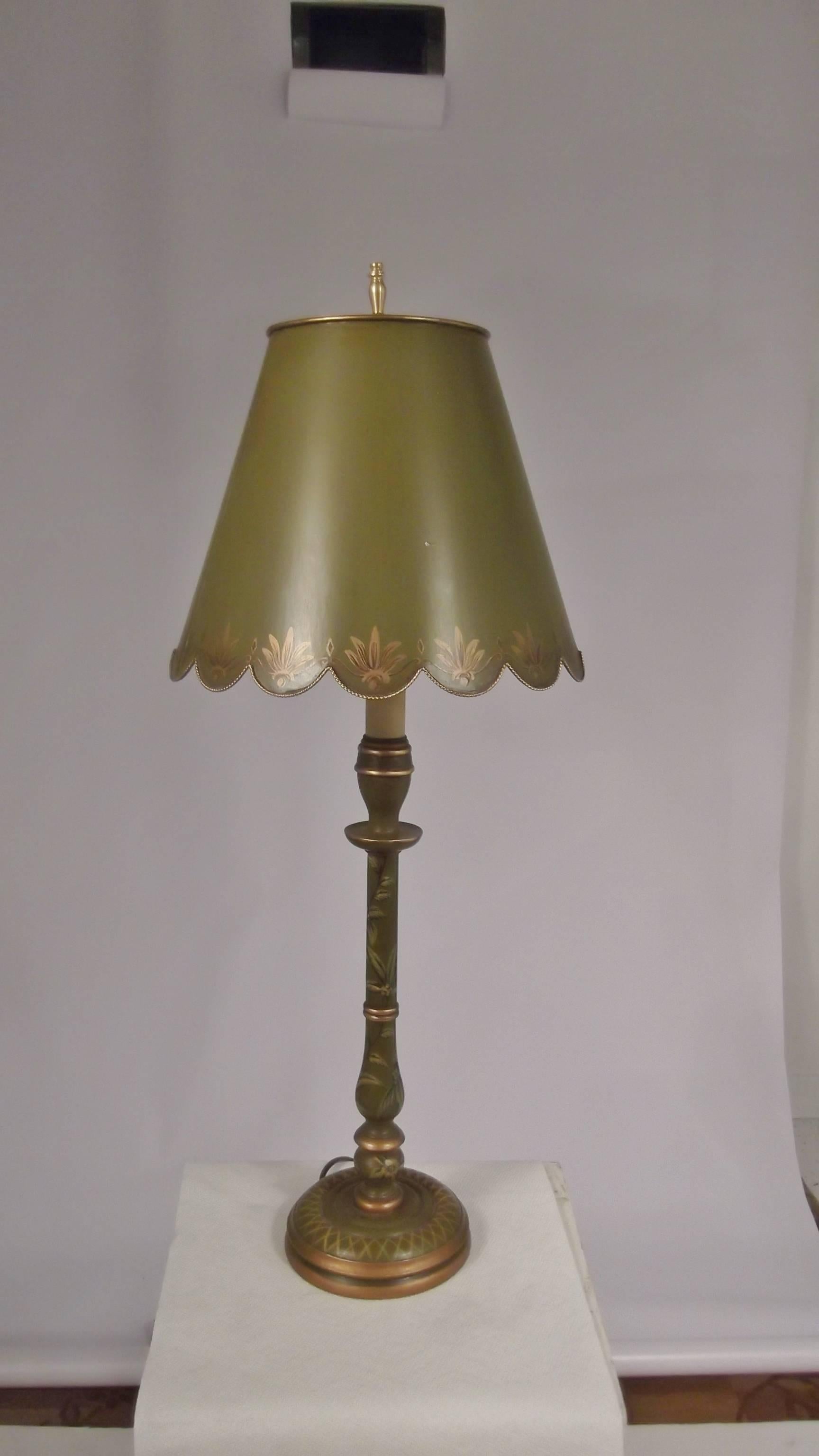 Italian hand-painted tole shaded lamps with hand-painted wood candle stick lamp bases. Apple green with hand-painted gilt decoration with white lined scalloped shades. Newer sockets and wiring.