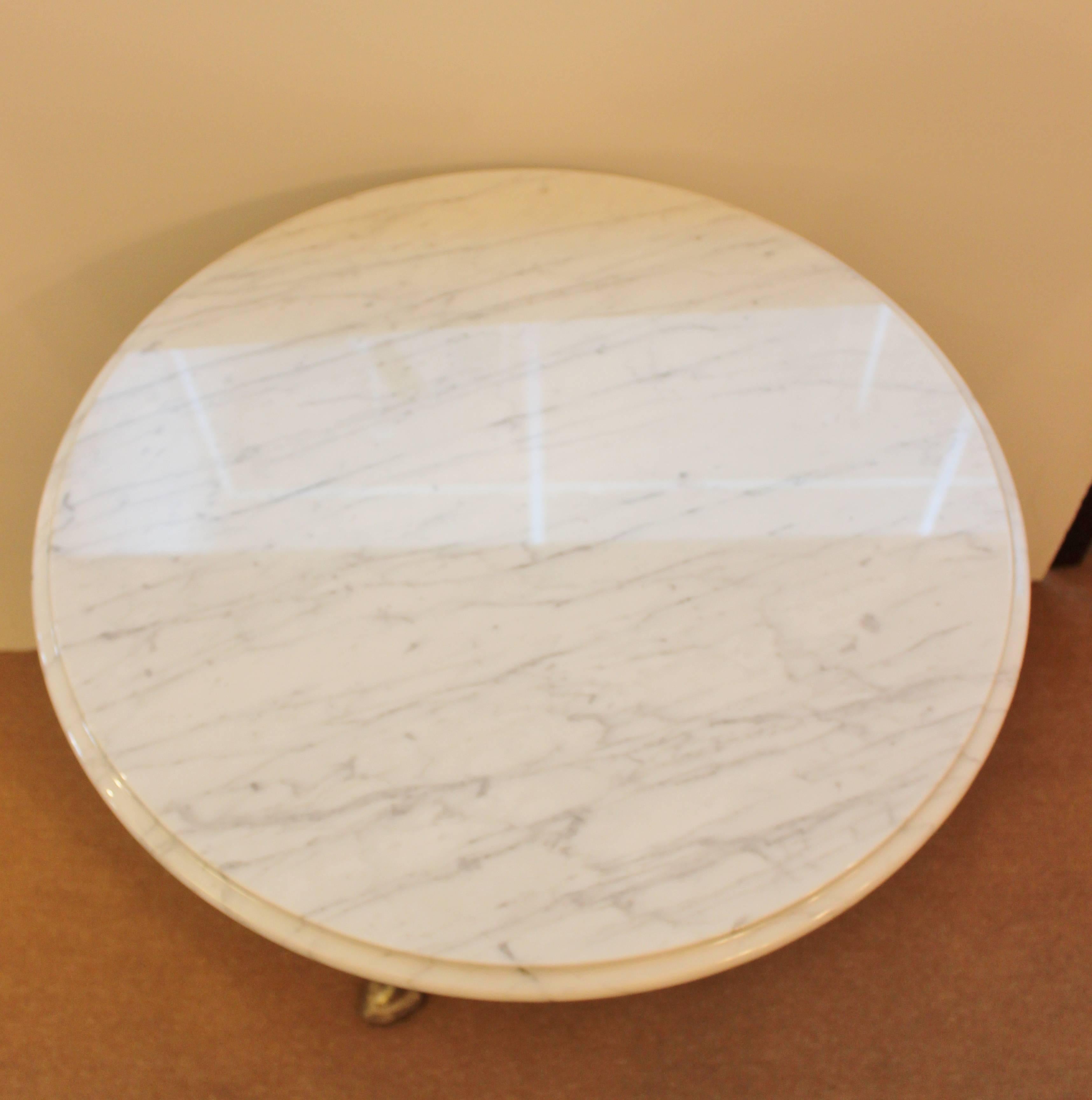 Unique round French silvered bronze table with palm branch base. The organic but flowing lines of the Art Nouveau style with white Carrara marble.