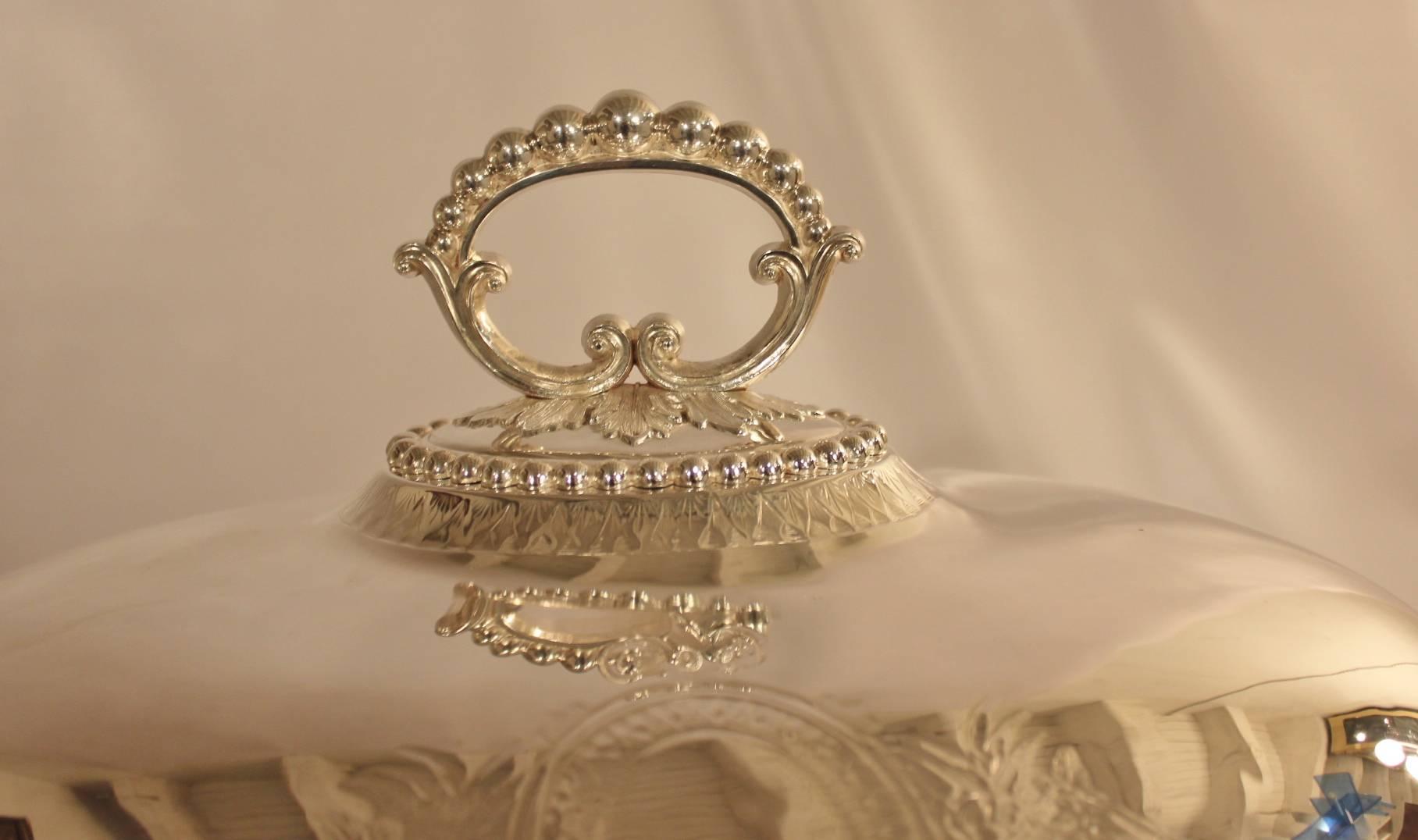 Handsome and large silver plate meat - entree dome. English made with full set of hall marks. The beaded handle sits atop the generous dome with elegant neoclassic Greek key detail. There is a beautiful medallion design on each side that has not