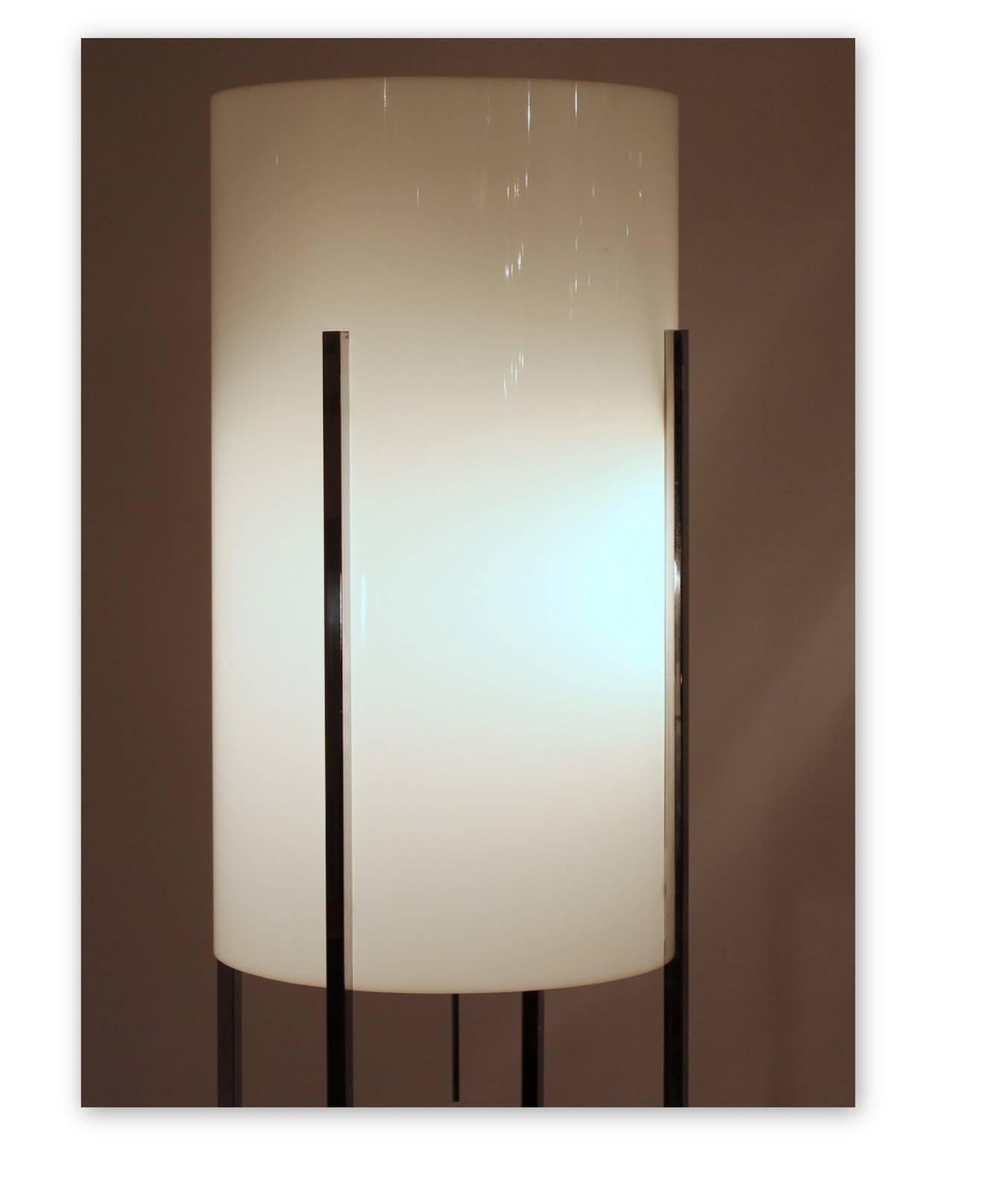 This vintage chrome base floor lamp with Lucite cylinder shade by Habitat, circa 1960s in USA, with six sockets, this lamp remains in good vintage condition. Wear to the bottom stretchers and is missing two of the plastic feet.