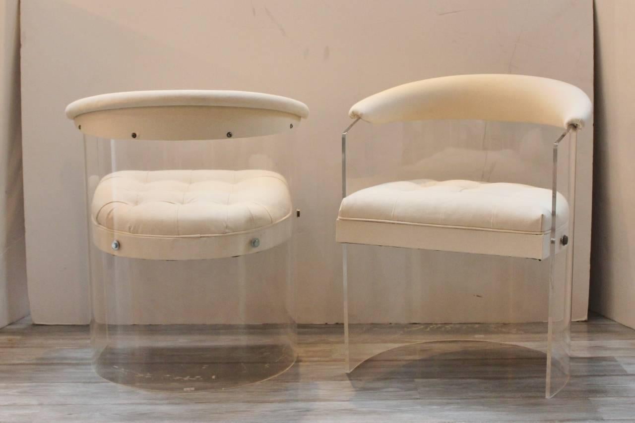 Small scale Lucite tub chairs with new upholstery. Sleek clean lines with a barrel back, upholstered upper back and arms with neatly buttoned seat. Covered in a natural sailcloth.