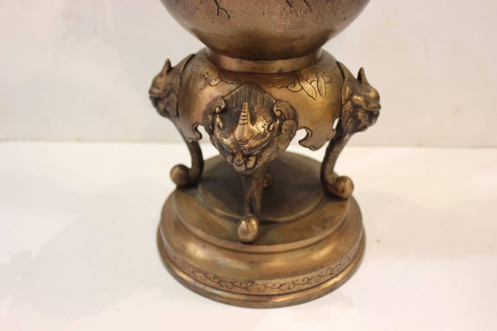 A pair of Japanese bronze finish Aesthetic Movement covered censors. The highly detailed bodes with birds and branches resting on a beautifully detailed base. The lids have an elaborate cast bird sculpture finial with subtle pierced areas. The