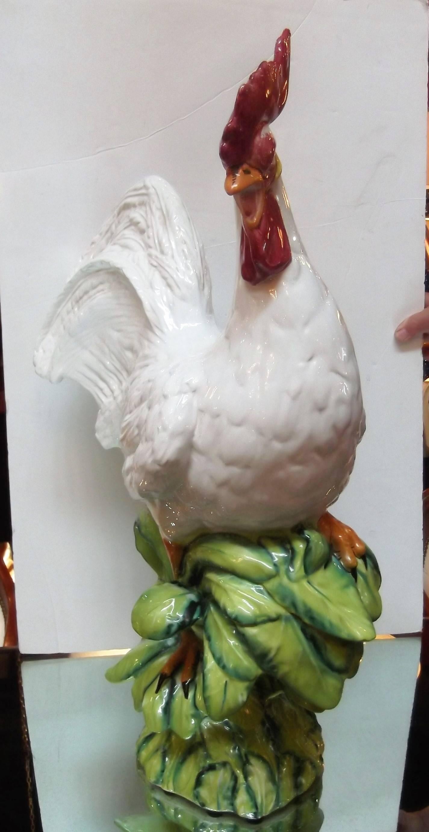 Large and impressive Italian ceramic rooster. Brightly colored features highlight the white body. Marked Made in Italy. A whimsical decorator item.