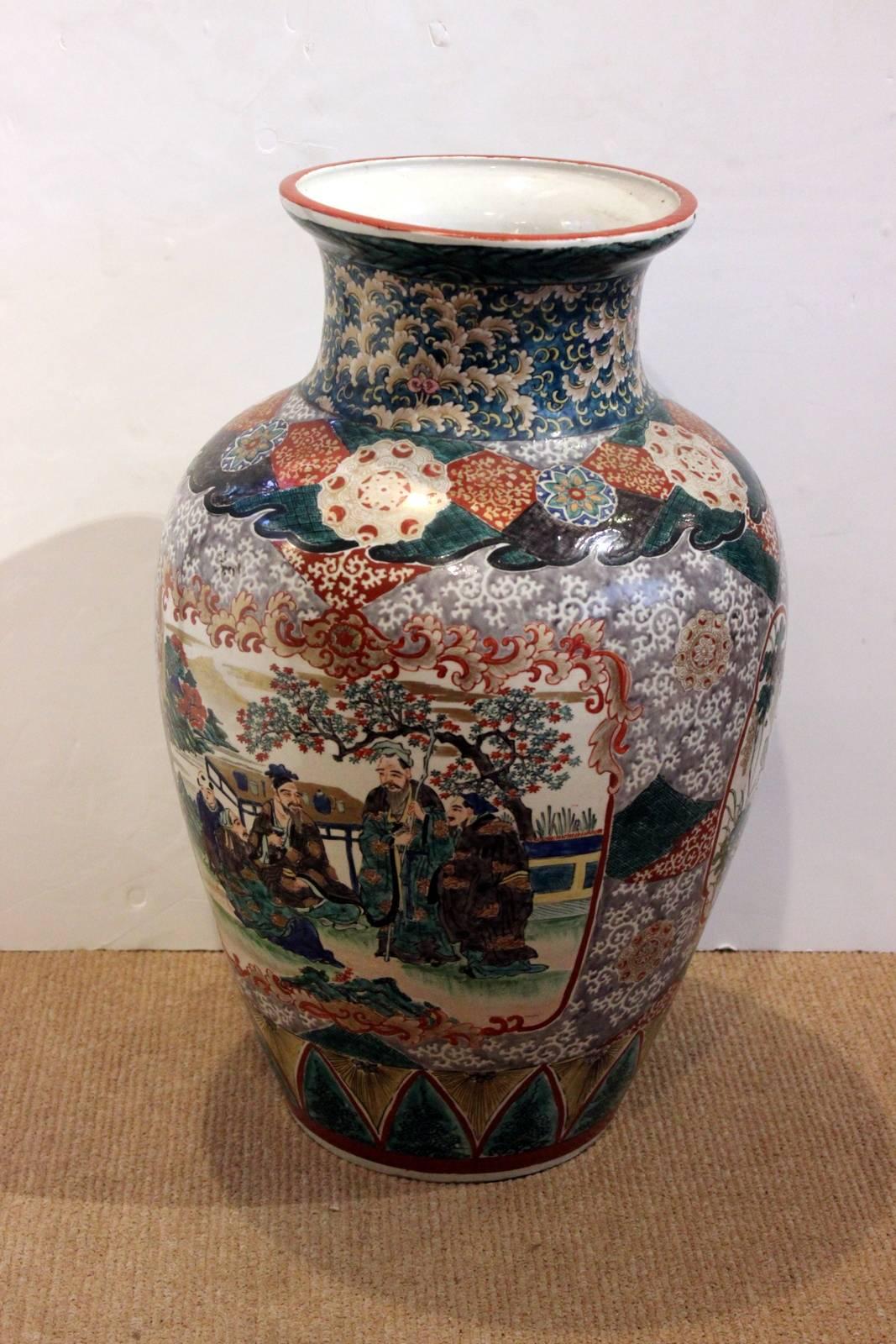 Meiji period in a Ko Kutani color palette. Late 19th century Japanese hand decorated porcelan vase a full 25