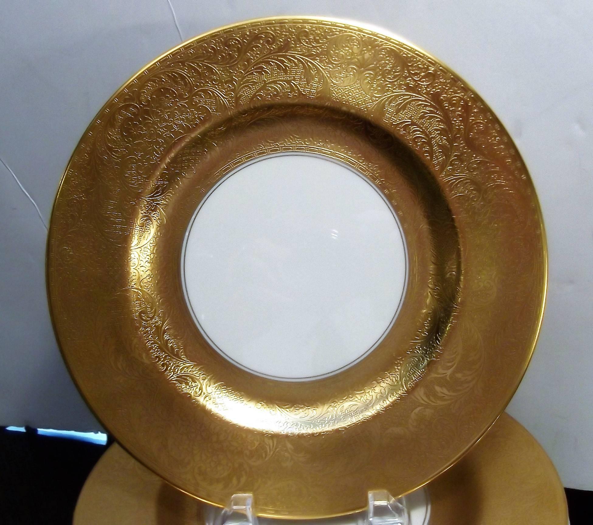 Lavish thick gold border service plates by Pickard. The luxurious borders are beautifully textured and over simple and Classic white China. A perfect set of 14. Diameter 10.5