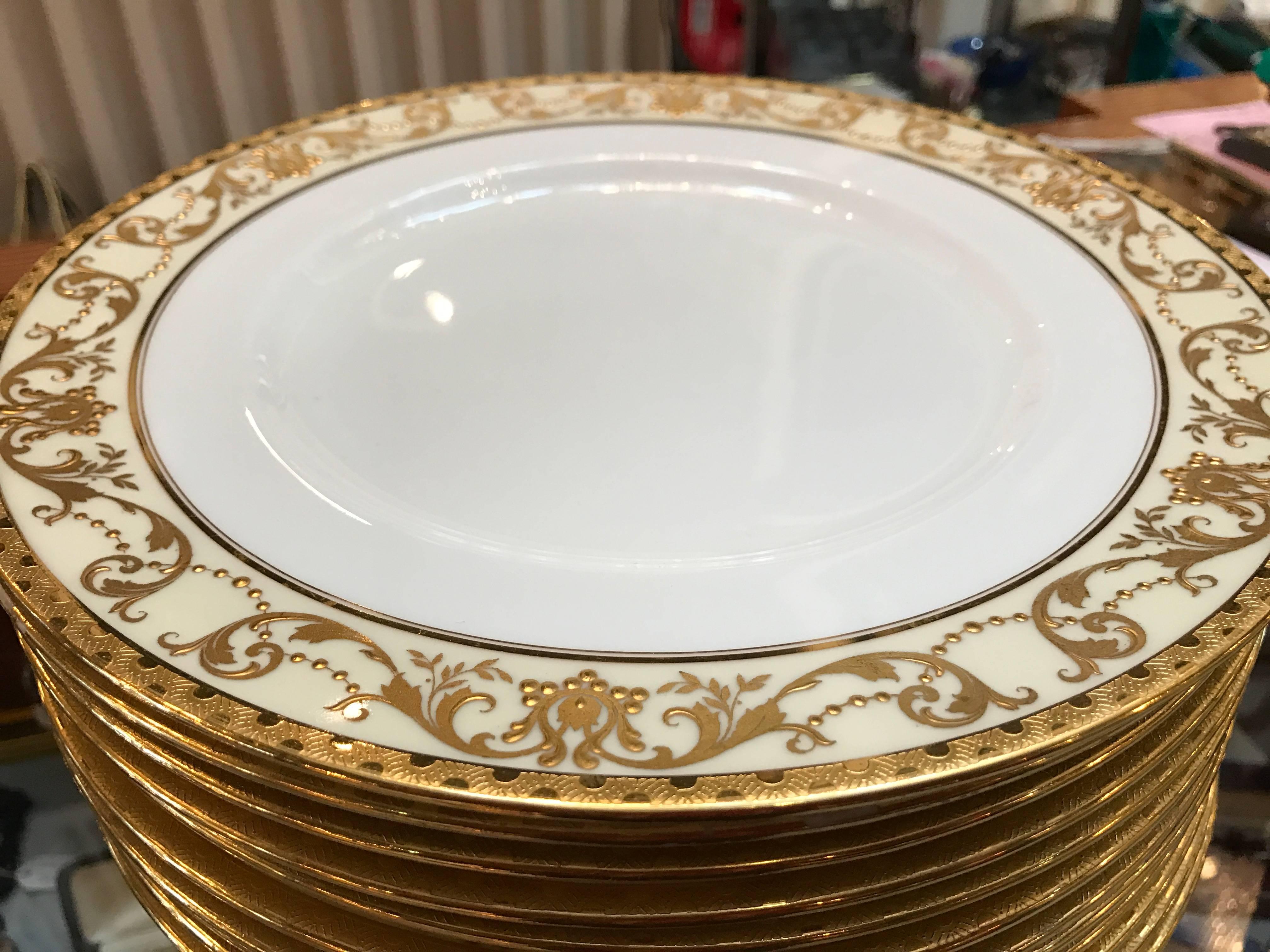 20th Century Set of 12 Gold Encrusted English Raised Gilt Service Plates