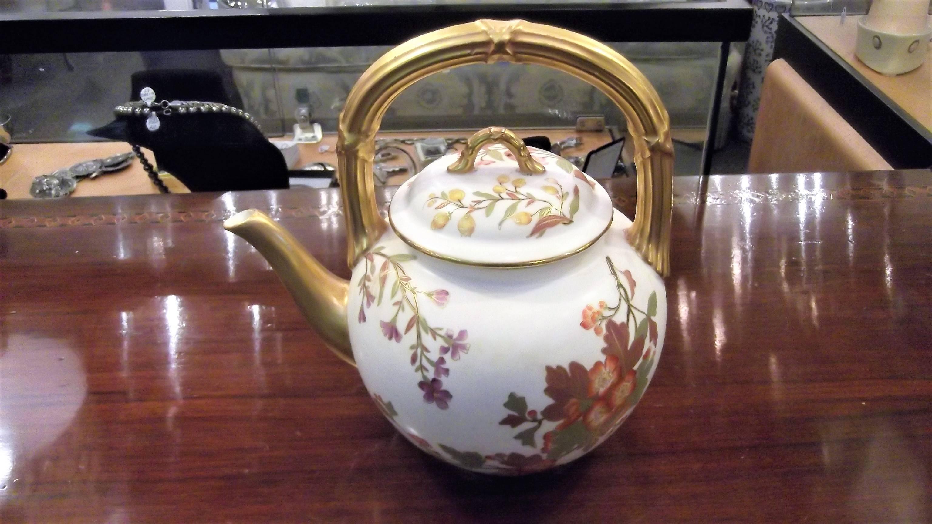 English tea set by Royal Worcester with hand-painted floral decoration. Each piece is decorated with hand applied gold. Year mark is 1889 and represents the Aesthetic Movement of the 19th century.
Teapot is 8