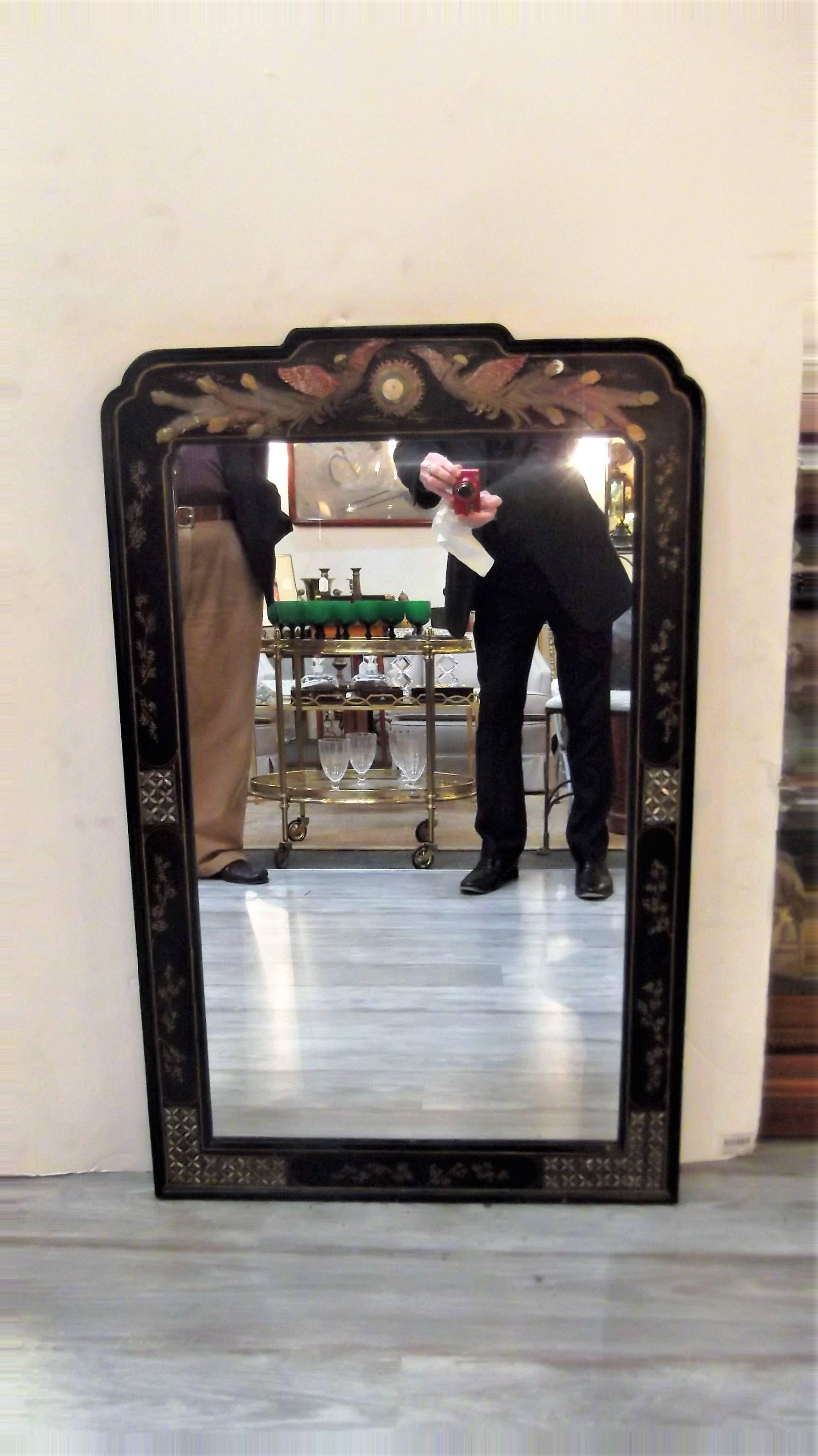Elegant black lacquered chinoiserie mirror with multi color stone inlay and mother-of-pearl inlay. Beautiful gilt accents with the high quality stone and mother-of-pearl inlay set this mirror apart, Early 20th Century, circa 1920.