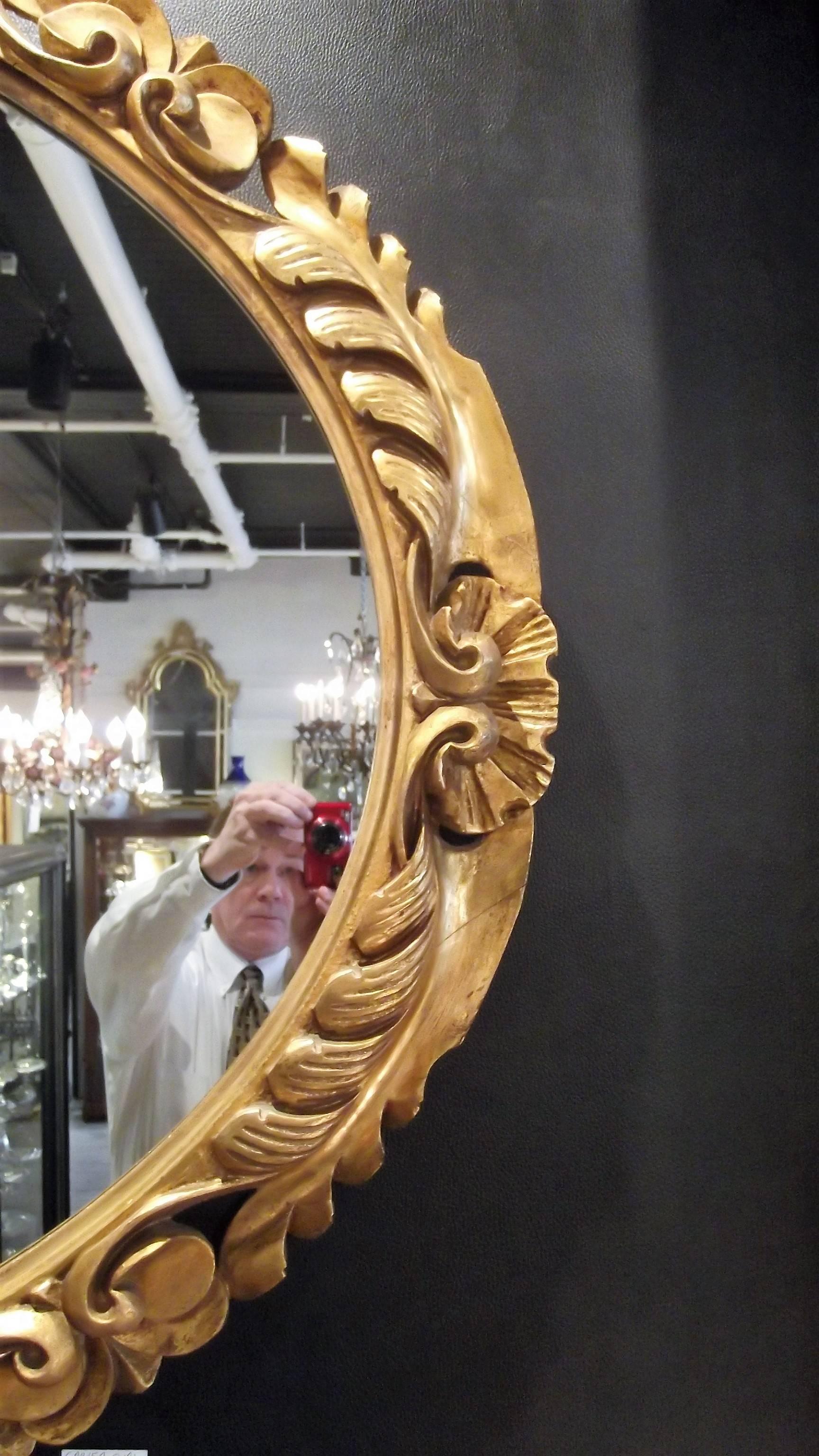 Large Oval Hand-Carved Giltwood Mirror In Excellent Condition In Lambertville, NJ