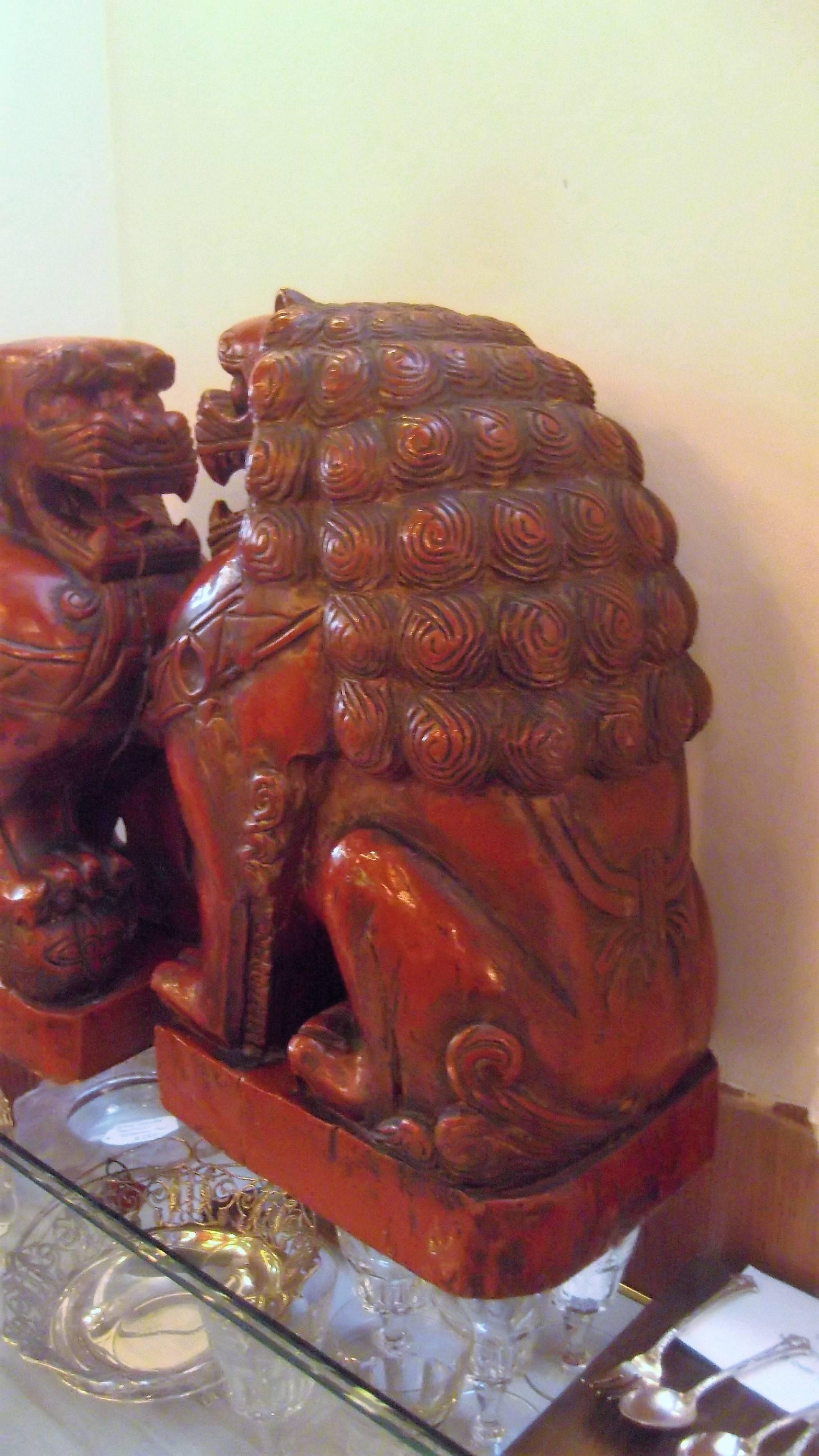 Pair of Cinnabar Lacquered Carved Wood Foo Dogs 1