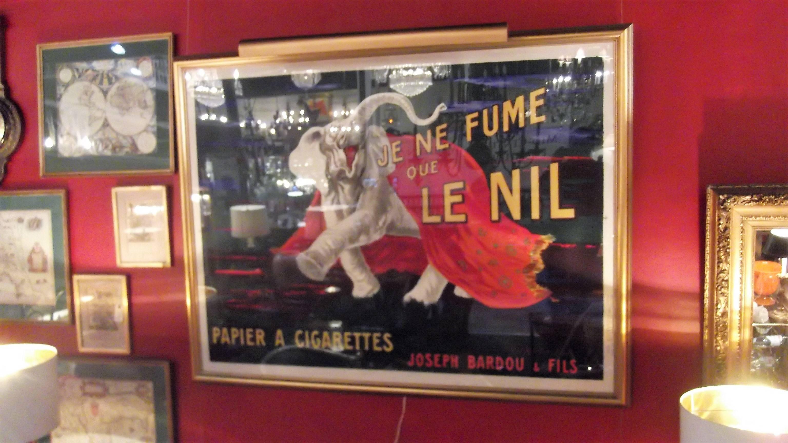 Je ne fume que le Nil by Cappiello Leonetto, 1912. The large and vibrant poster professionally framed and under a UV protected Plexiglas. The poster is in excellent condition with all the colors intact.