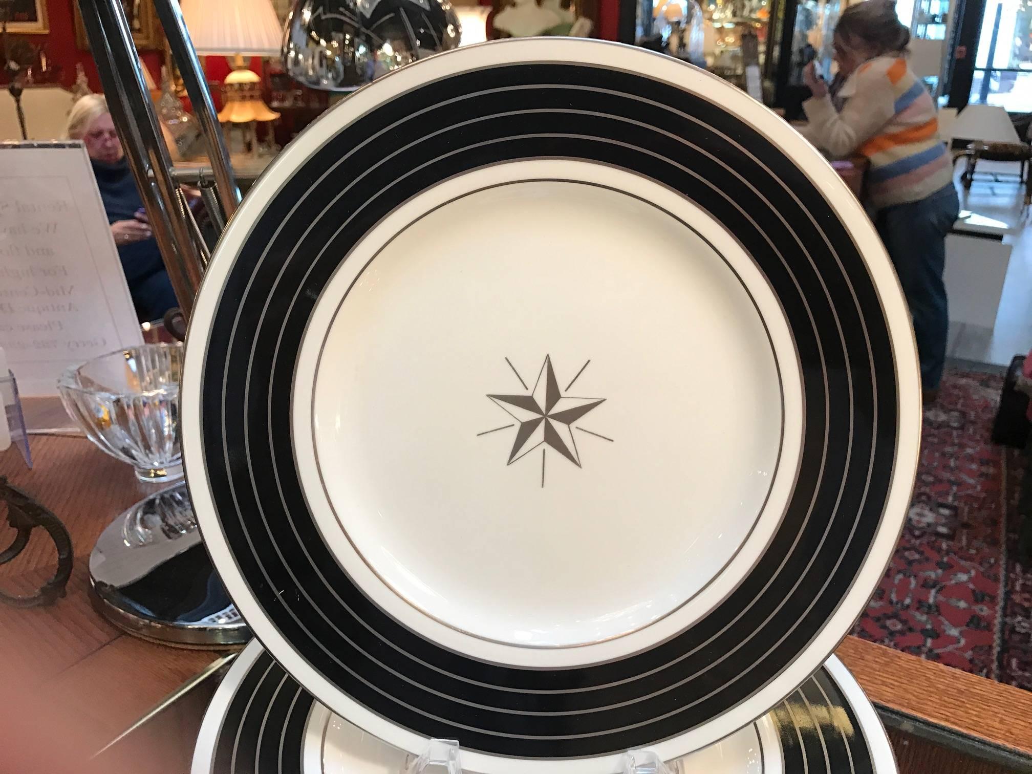 Chic set of English service plates with platinum and black borders. The mark used on these Minton plates are pre-1950, these being 1930s
The borders are alternating circles of back and platinum gilt with a center platinum gilt star medallion.
Please