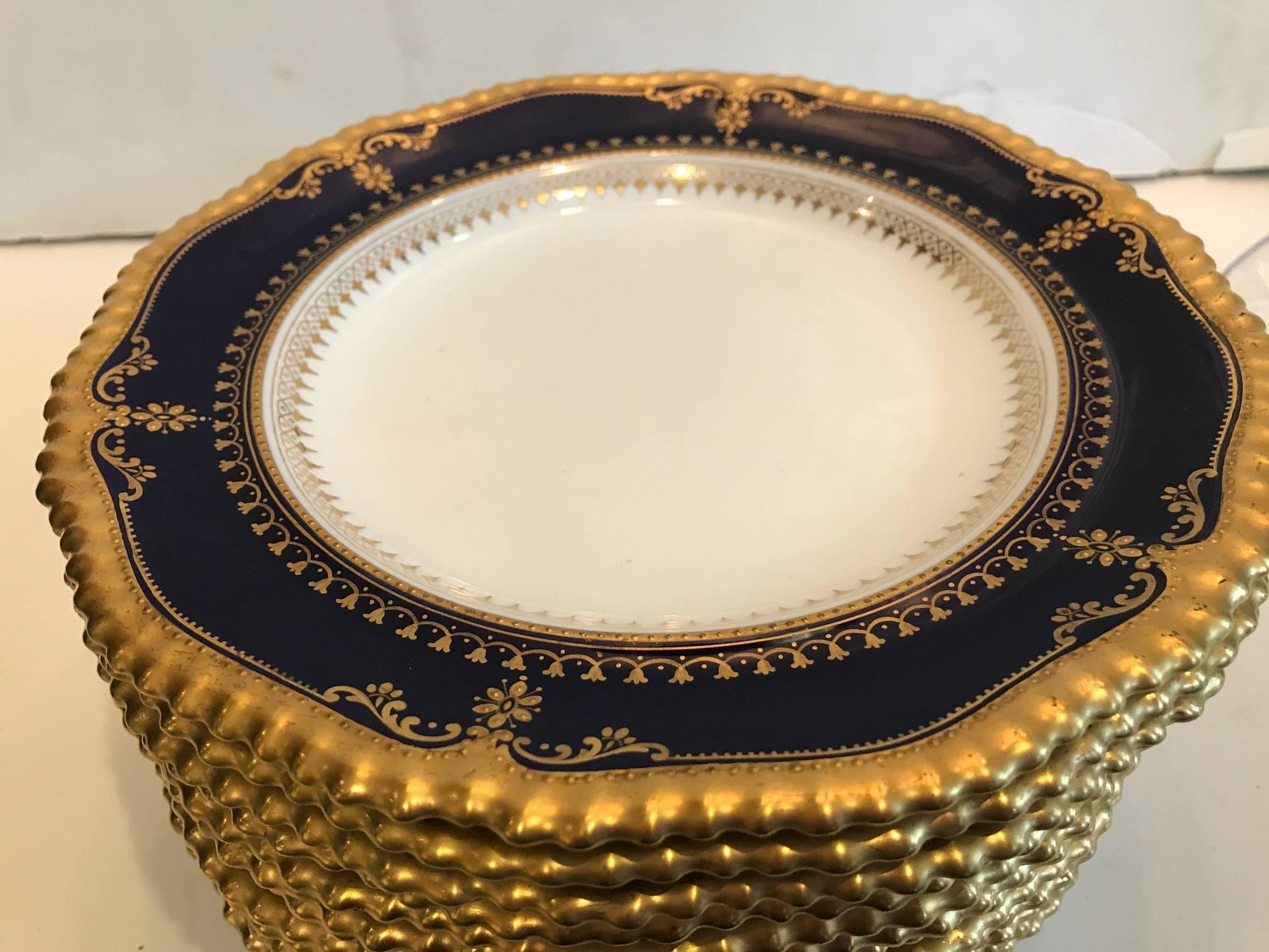 12 cobalt and gold 9 inch accent plates with hand gilding. Made in England by Cauldon, markings date these to 1910, slight gold wear to a few on the inside ring from staking, otherwise excellent condition.
Edwardian elegance.