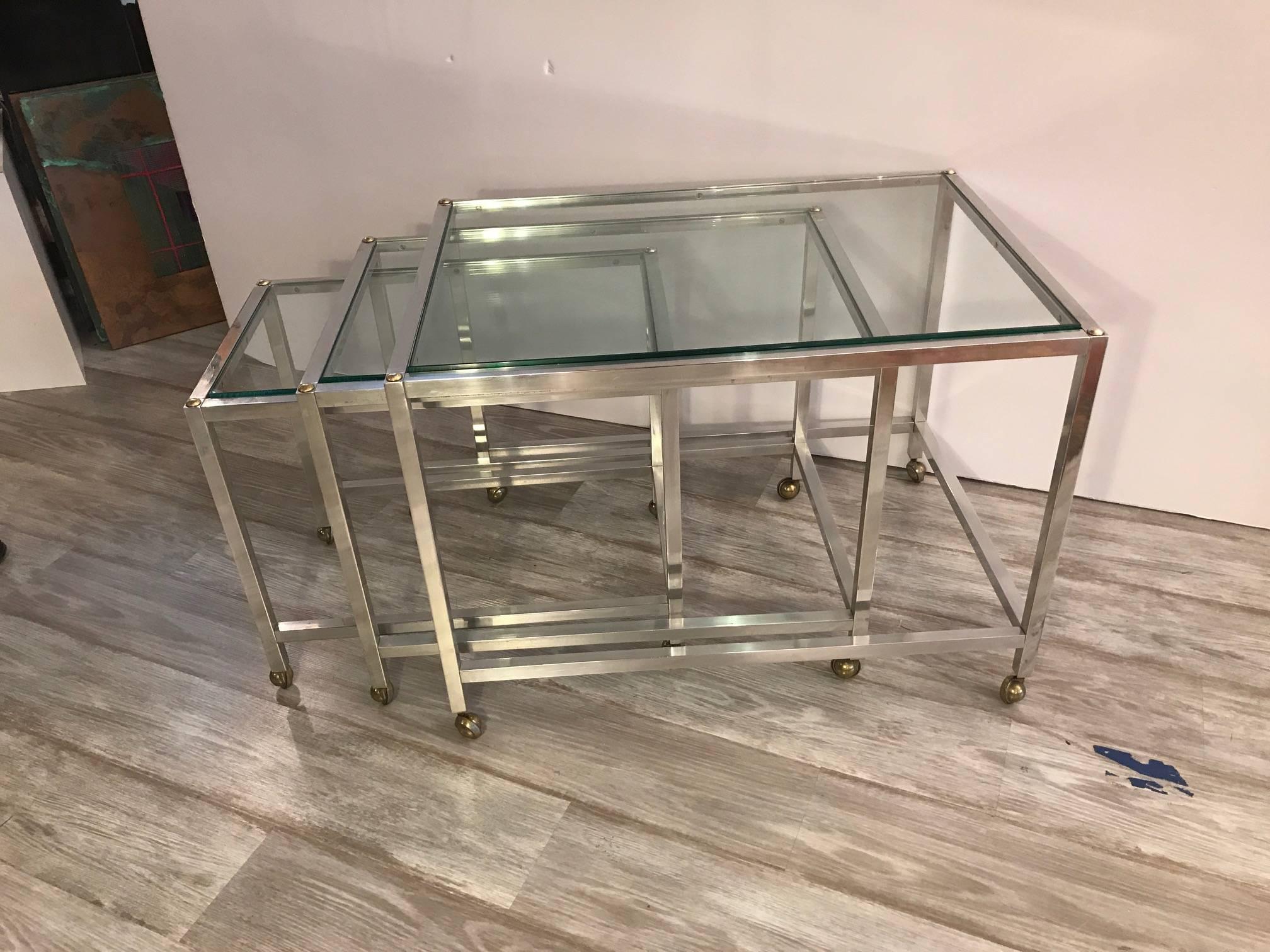 American Set of Three Polished Aluminium and Glass Nesting Tables