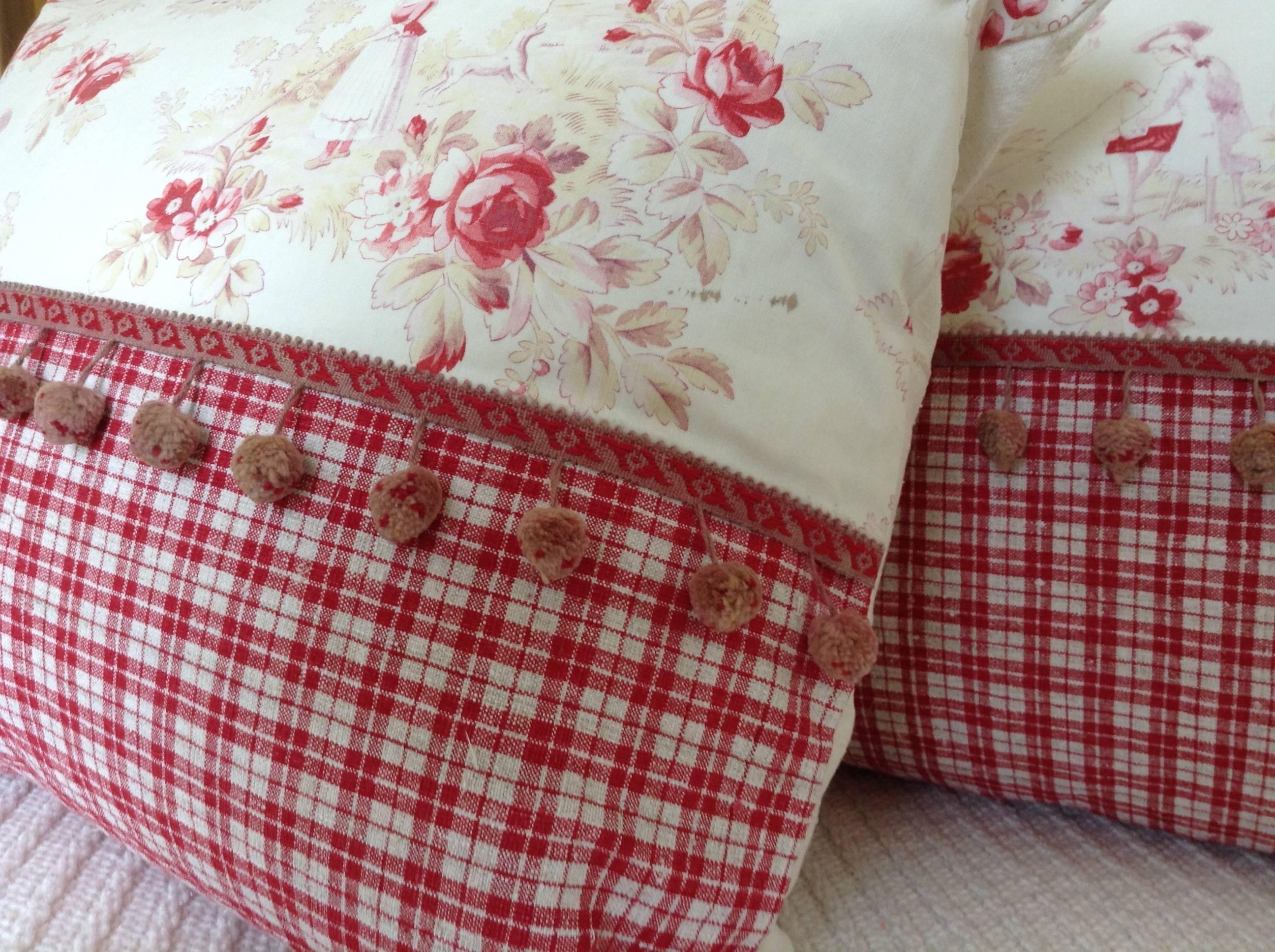 These charming pillows feature a classic French Toile de Jouy landscape depicting rural life in France. Coordinated below with an outstanding red homespun linen Kelsch and a charming pom pom trim.
Backed with a superb homespun linen and hand