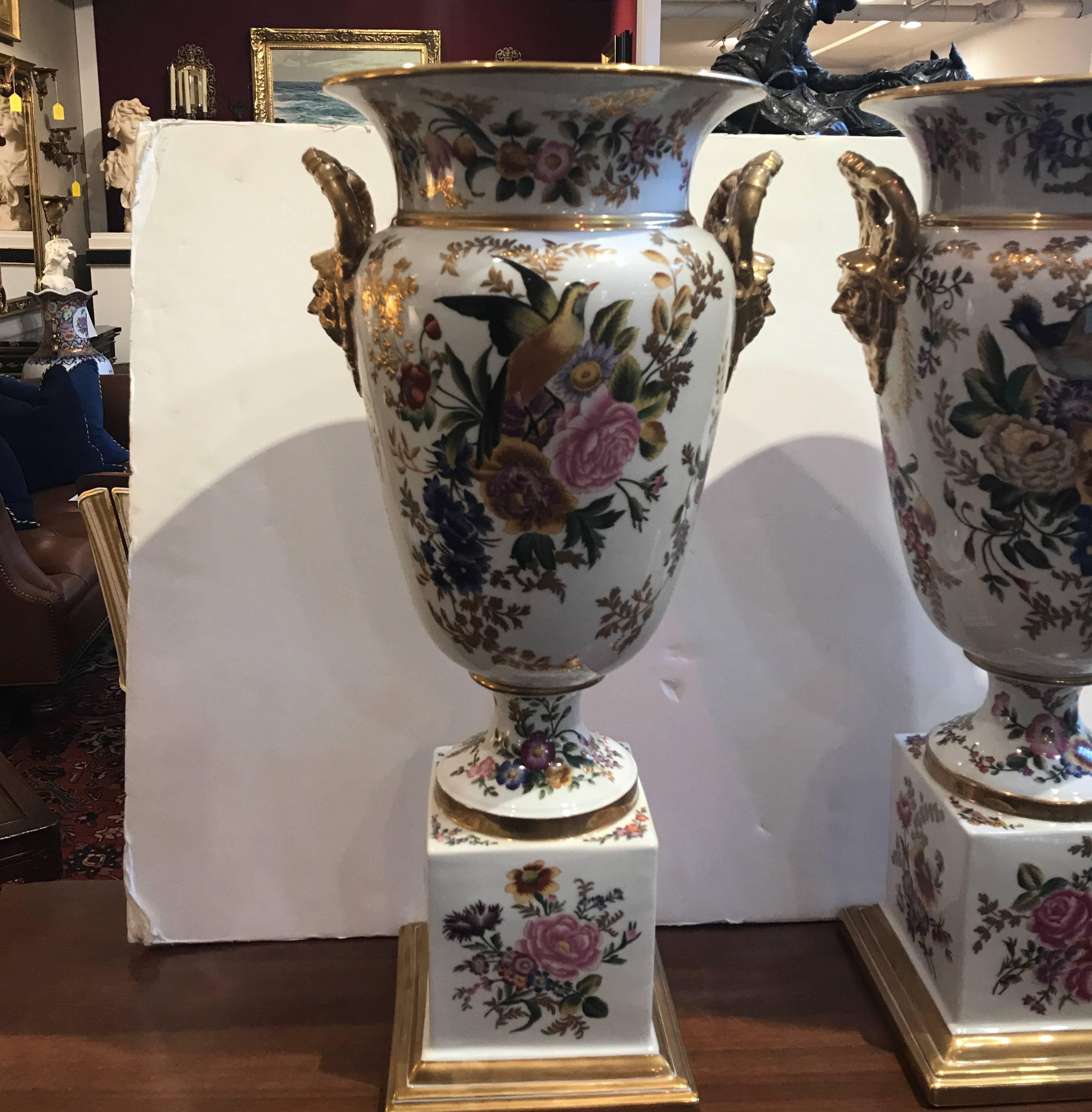 Elegant and grand hand-painted porcelain urns in the style of Old Paris. These are made by Chelsea House. These are of large size and scale with impressive hand-painted birds and floral decoration in the old Paris porcelain style of the 19th