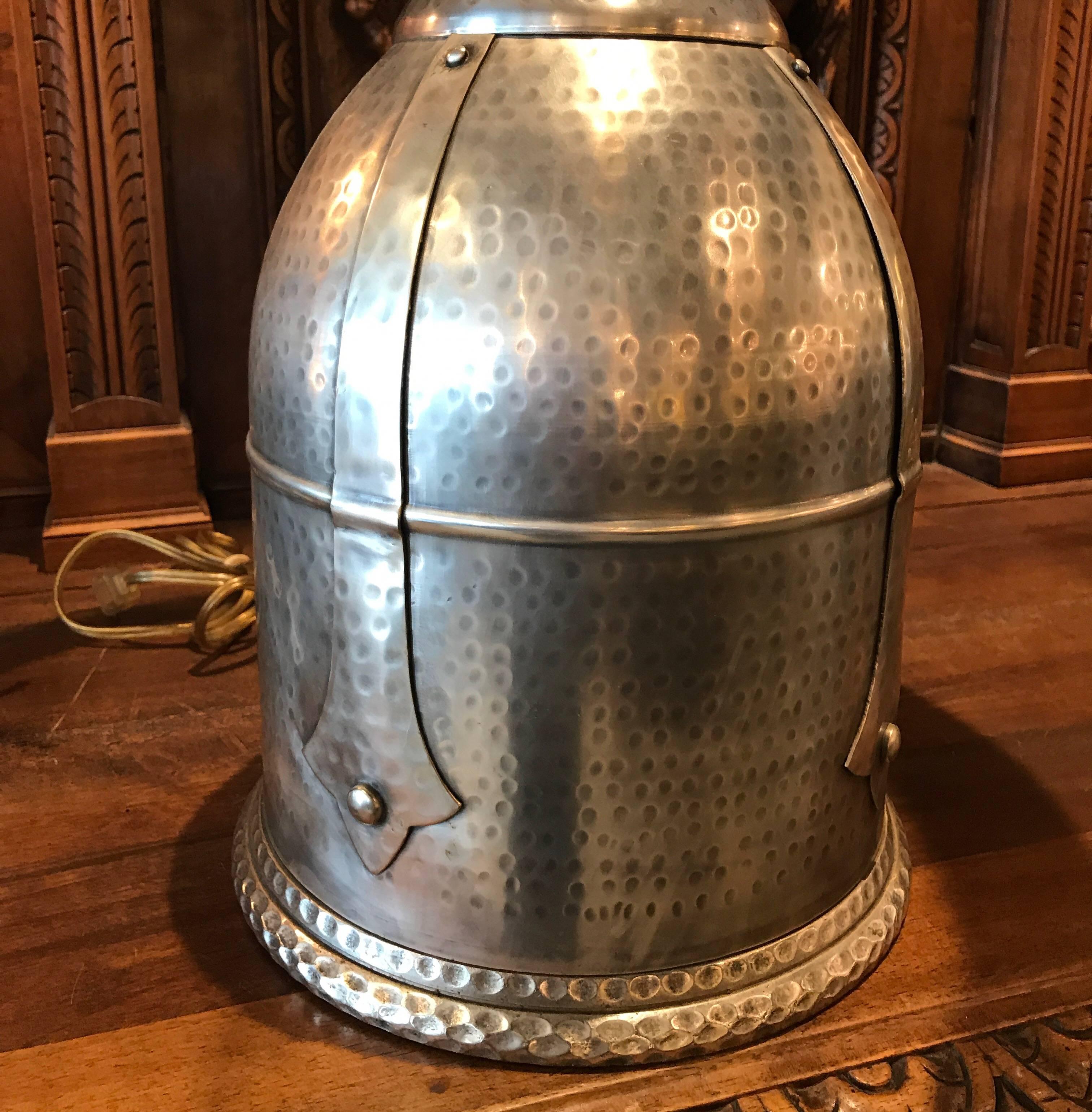 A fine pair of silvered brass or bronze hand-hammered lamps. The height of the lamp ti the socket is 17 inches, the height to the top of the harp is 24 inches, this can be adjusted higher based on the shade used. The diameter of the base is 10