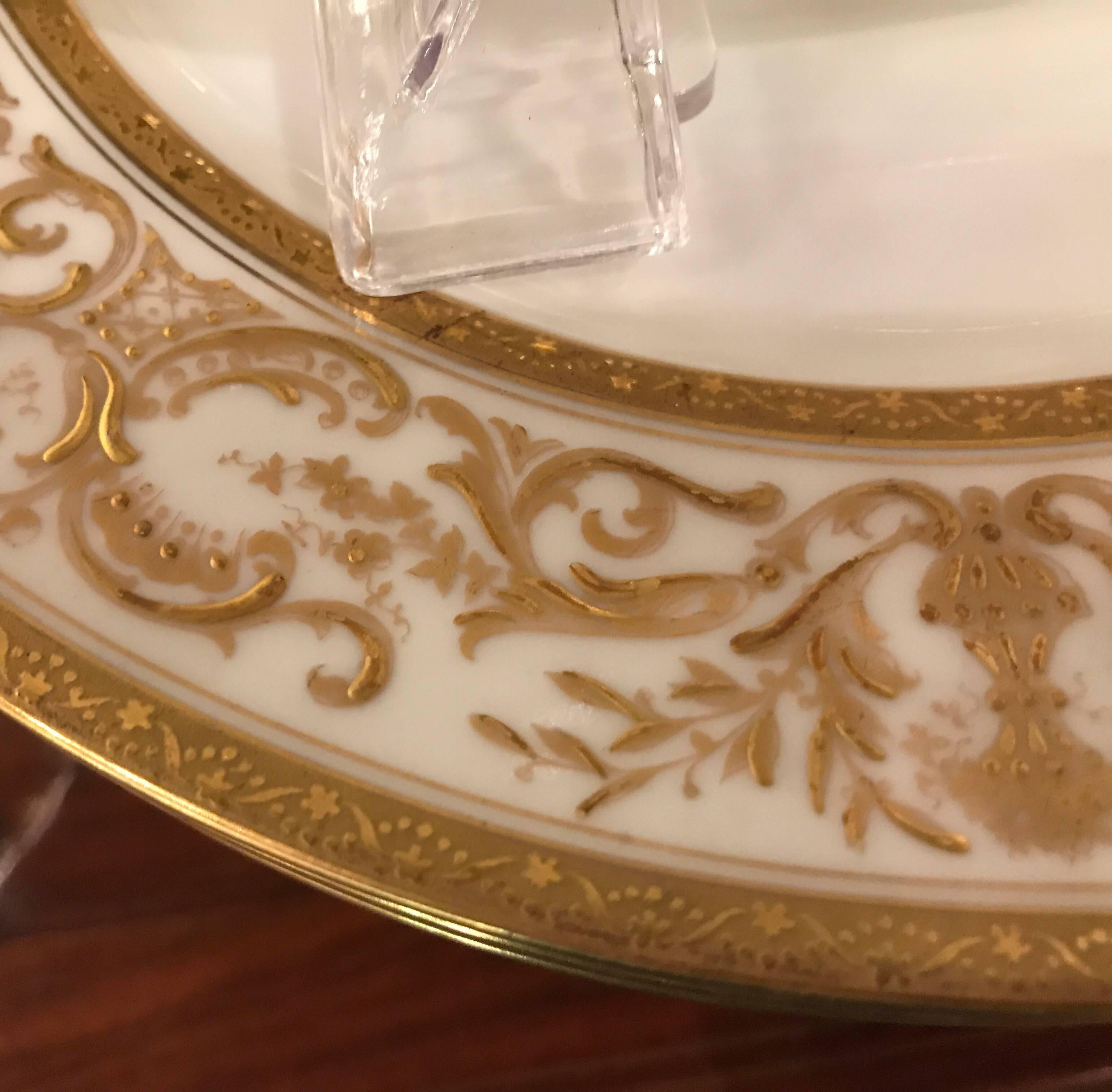 Hand-Painted Set of Ten French Plates with Raised Gilt Borders