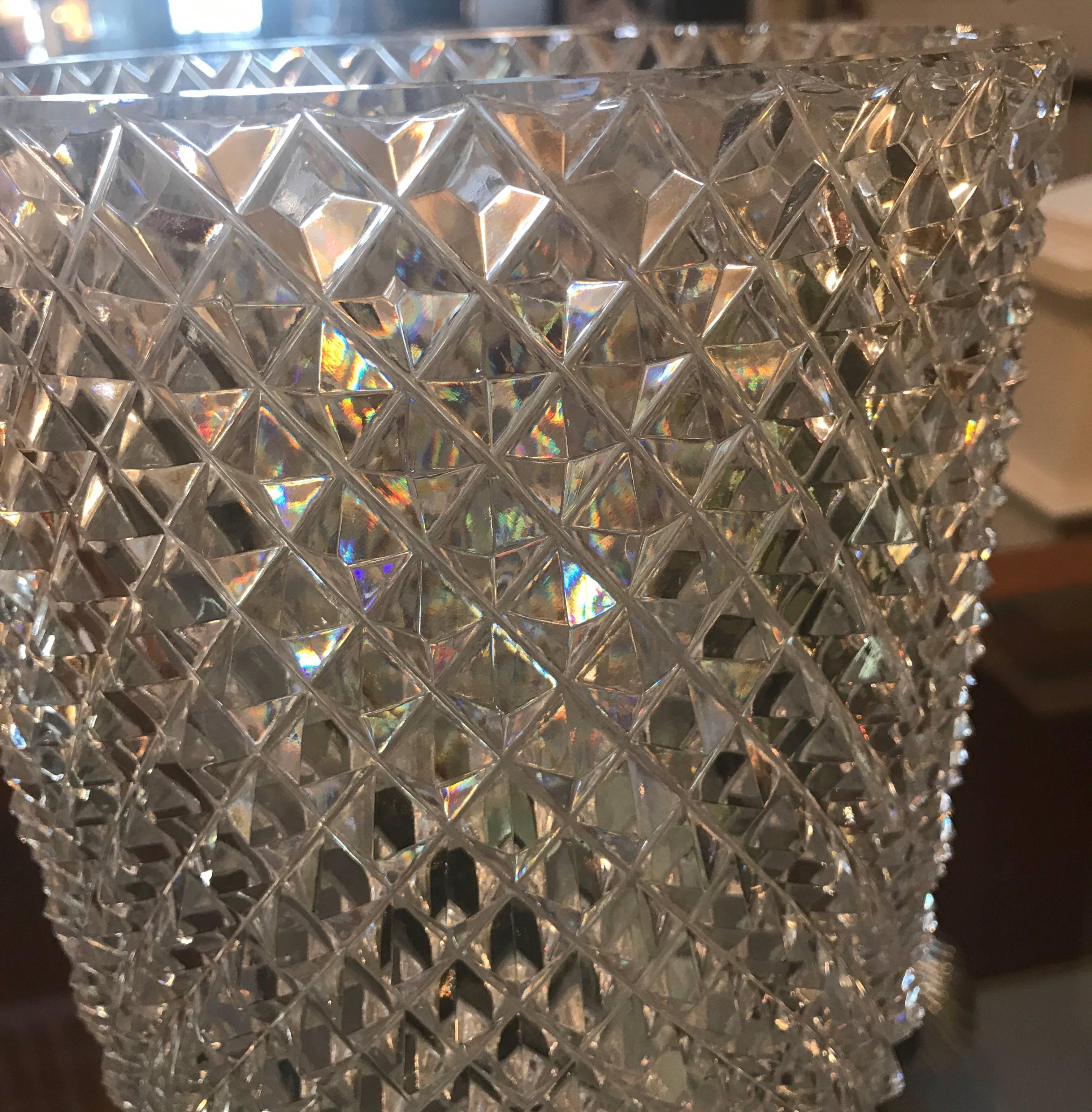 Substantial diamond cut flower vase. Beautiful all-over diamond pattern with starburst bottom. This vase is expertly cut and polished on a wheel, all by hand is a shimmering mirror finish glass. Very sharp and crisp cuts, perfectly symmetrical with