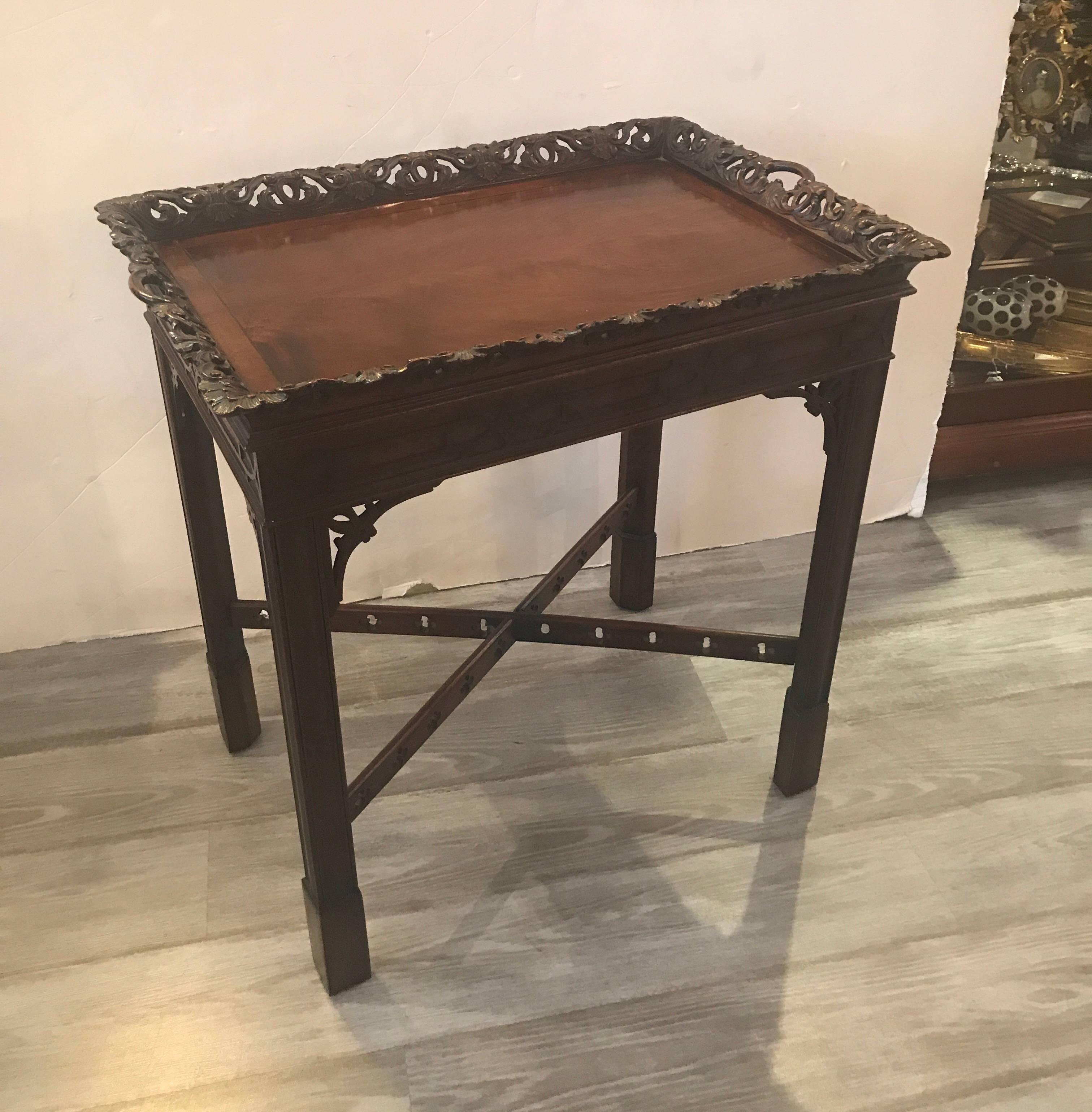 The lift off hand-carved tray top with pierced border. The base with classic Chinese Chippendale styling. The diminutive size is perfect for a tea service, or small bar or dessert server.