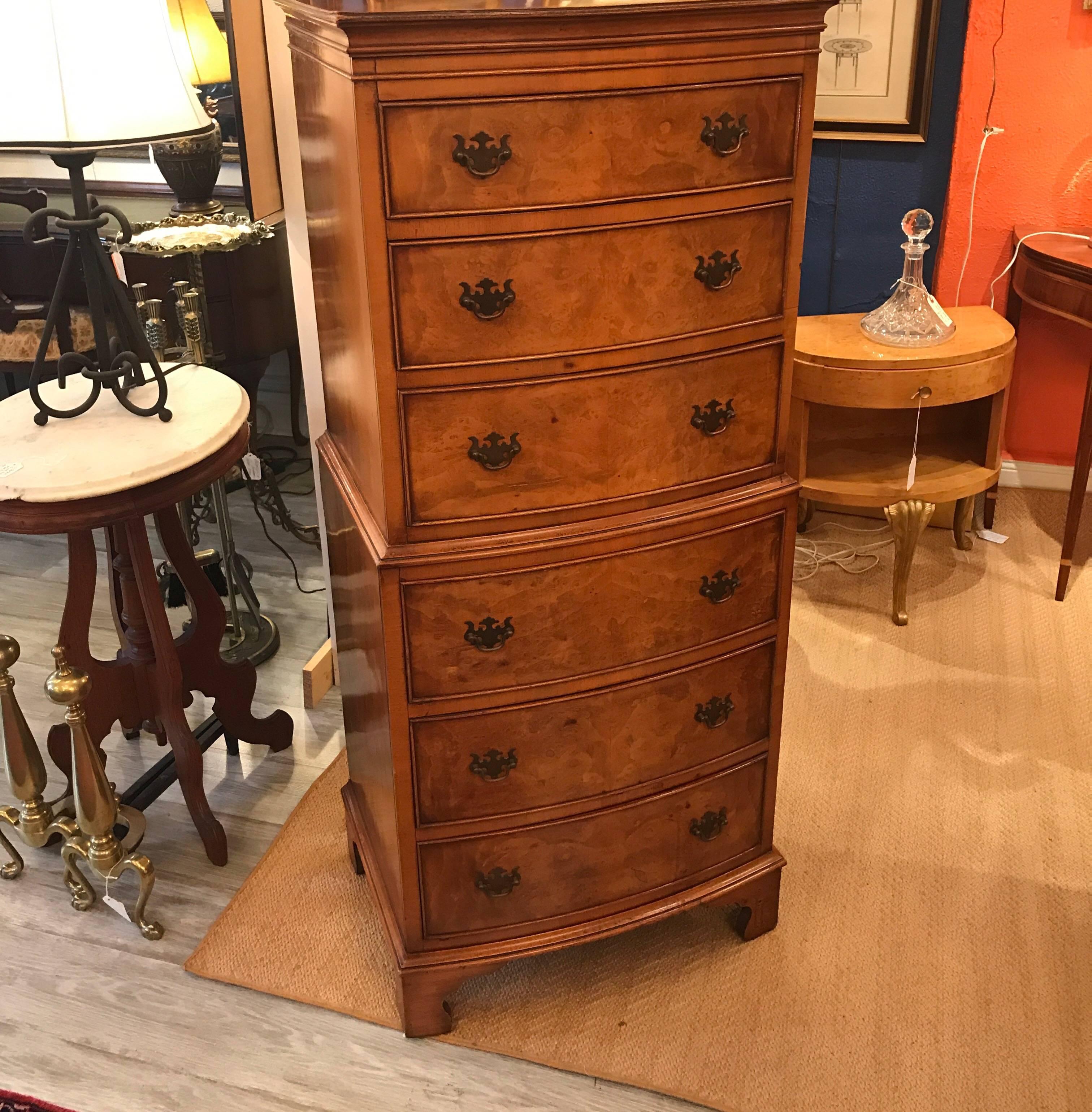 Classic English diminutive chest on chest. The taller and narrow form with three drawers over three all with dovetailed construction, each with two drawer pulls. The chest sits on four bracket feet. This is a Fine cabinetmaker piece, made in England