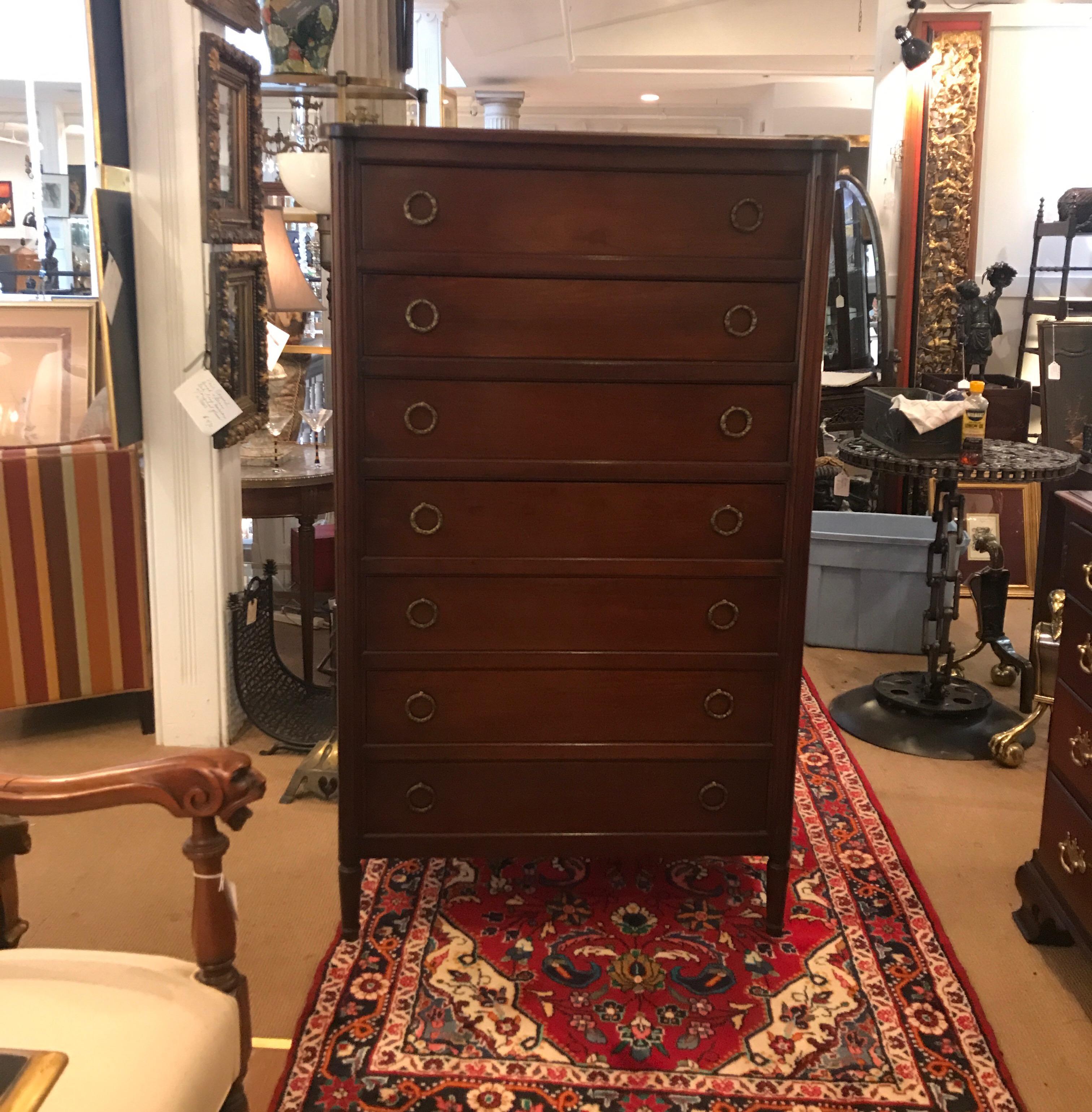 High quality custom made tall chest by Cassard Chateau of NYC. The chest with 7 drawers one being a fall front drawer. The original hardware is a finely cast bronze.