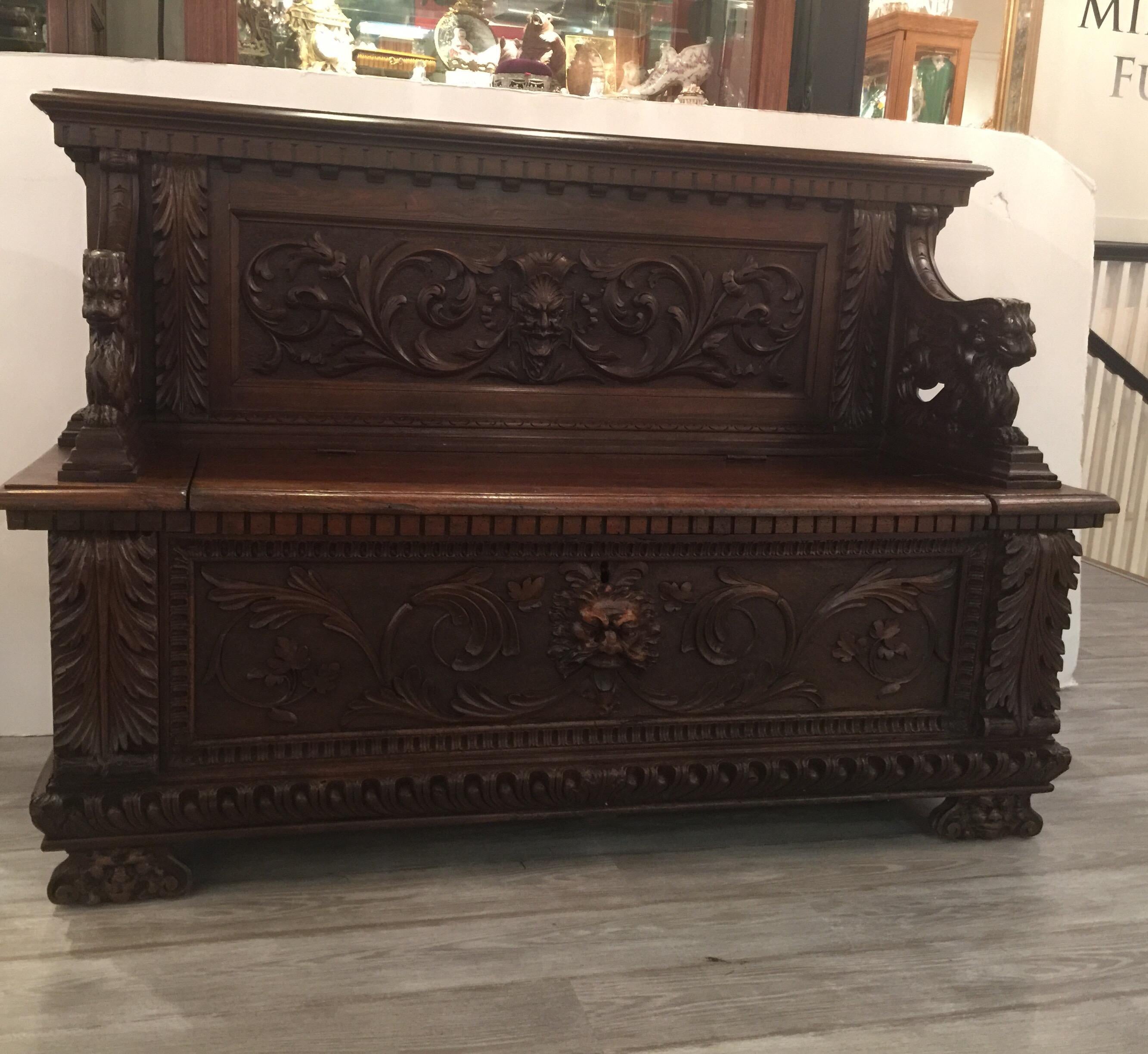 Hand carved European walnut hall bench with griffins and lion faces, circa late 1800s.
Great hand done carvings. Nice hall bench with lift up seat for plenty of storage.
Dimensions: 64