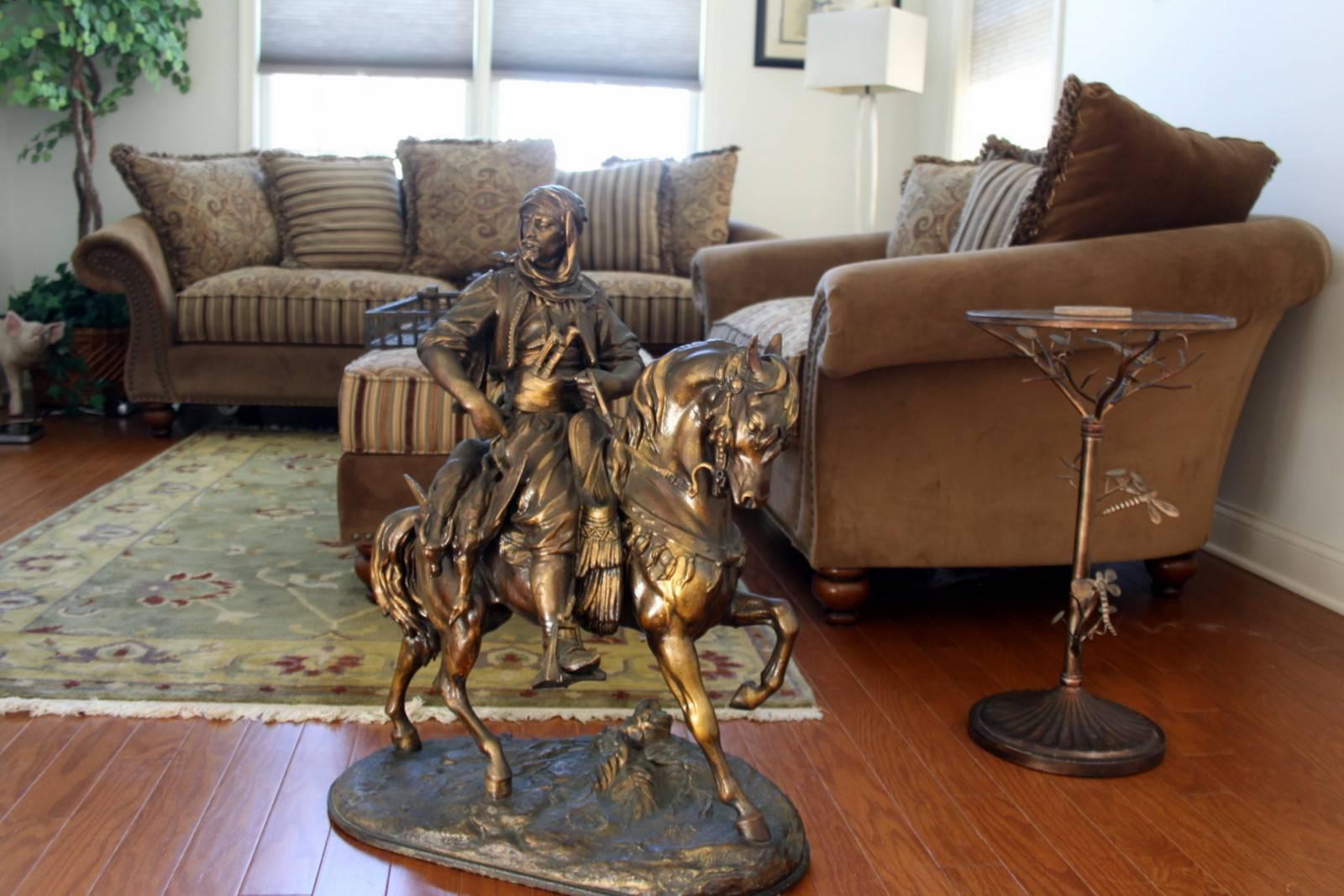 A FRENCH SPELTER EQUESTRIAN 
LATE 19TH CENTURY, AFTER JEAN BAPTISTE EUGÉNE GUILLAUME
 (1822-1905) 
Depicting an Arab huntsman on horseback carrying dead game, the naturalistic base inscribed 'E. Guillaume' to the lower right and 'Barye Fils' to