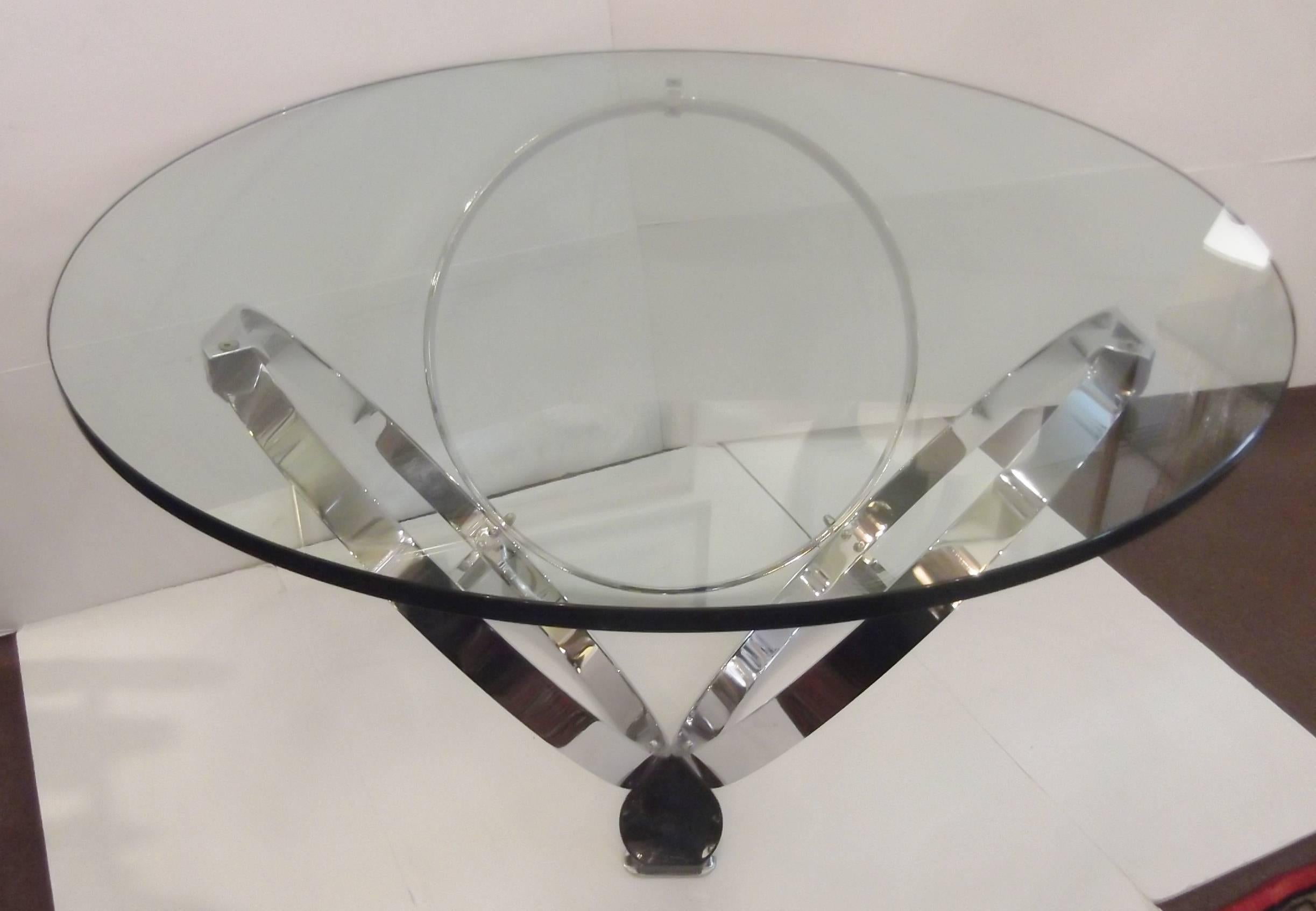 Space Age styling round glass top cocktail table with three ring solid steel chrome base.  Sturdy base easily support the 3.4