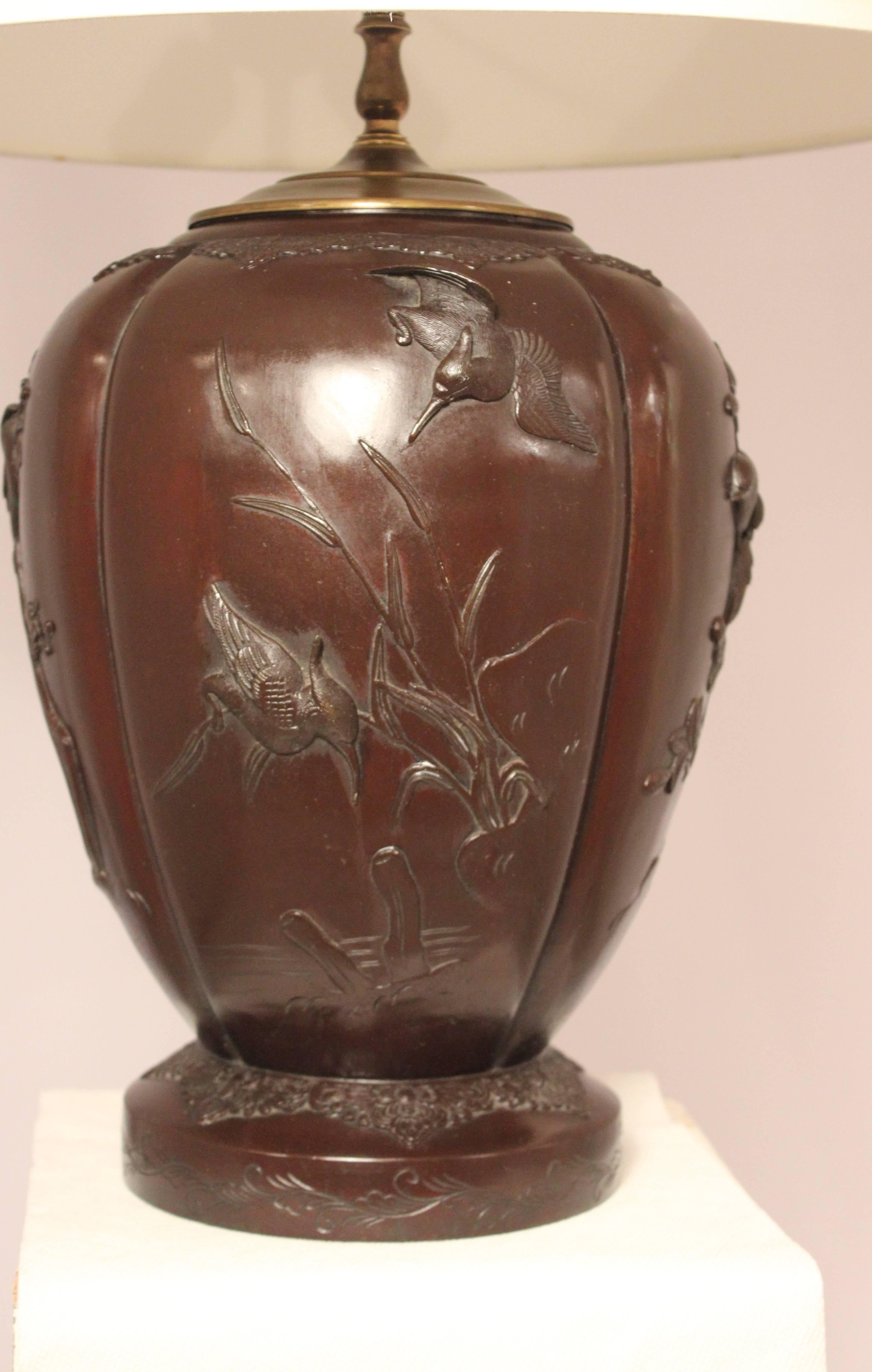 High quality bronze urn from the Meiji period, late 19th century. Lamped in the 1920s, this urn has detailed casting of hummingbirds and branches and retains its original rich brown with red undertone patina. The shade is for photographic purposes