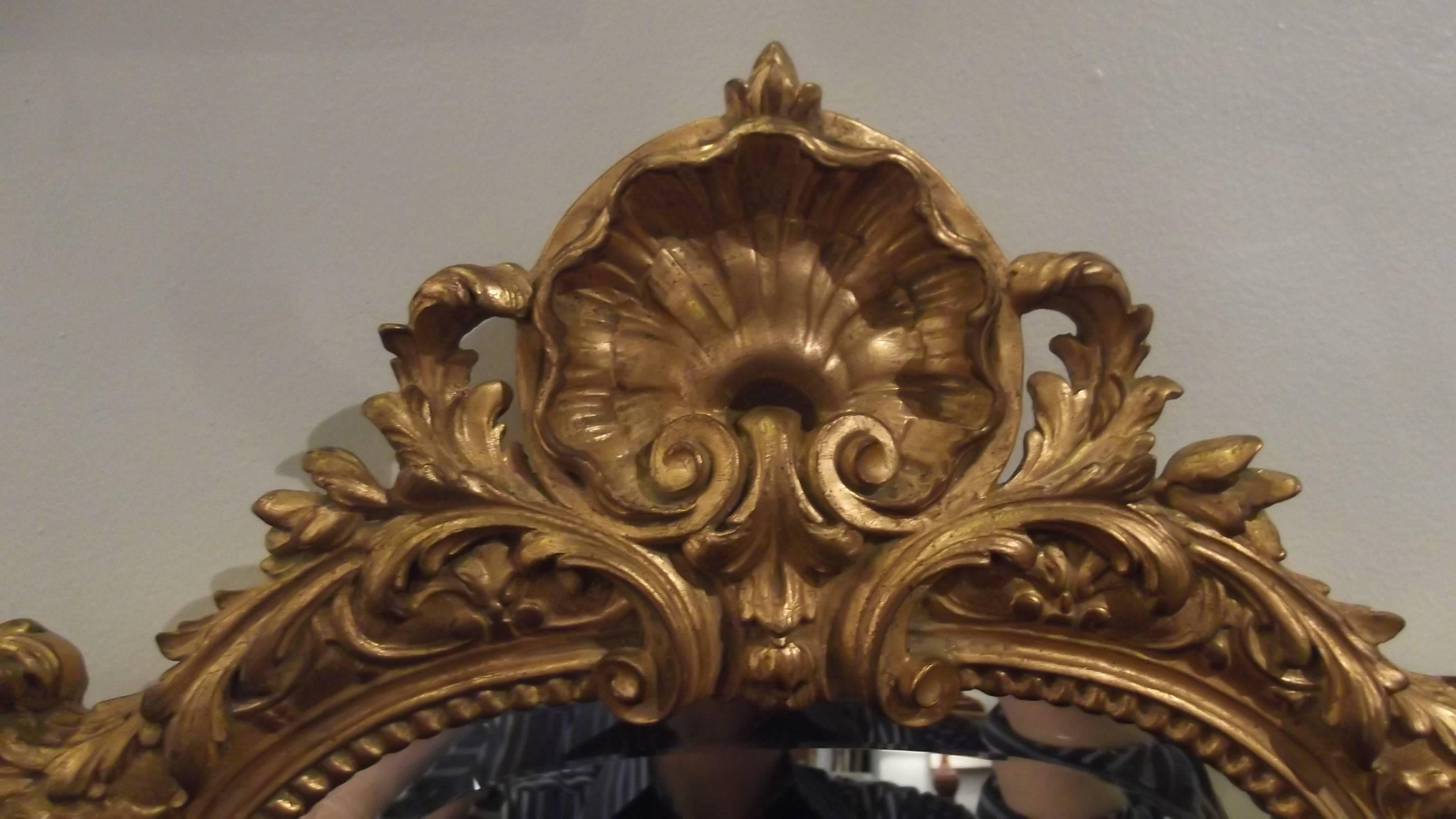 Beautiful Louis XV Style beveled mirror. Made by Carvers Guild, a high end American company
Styled after and original 18th century looking glass in a charming antique shop in Barbizon, France. This refined and delicately detailed frame with