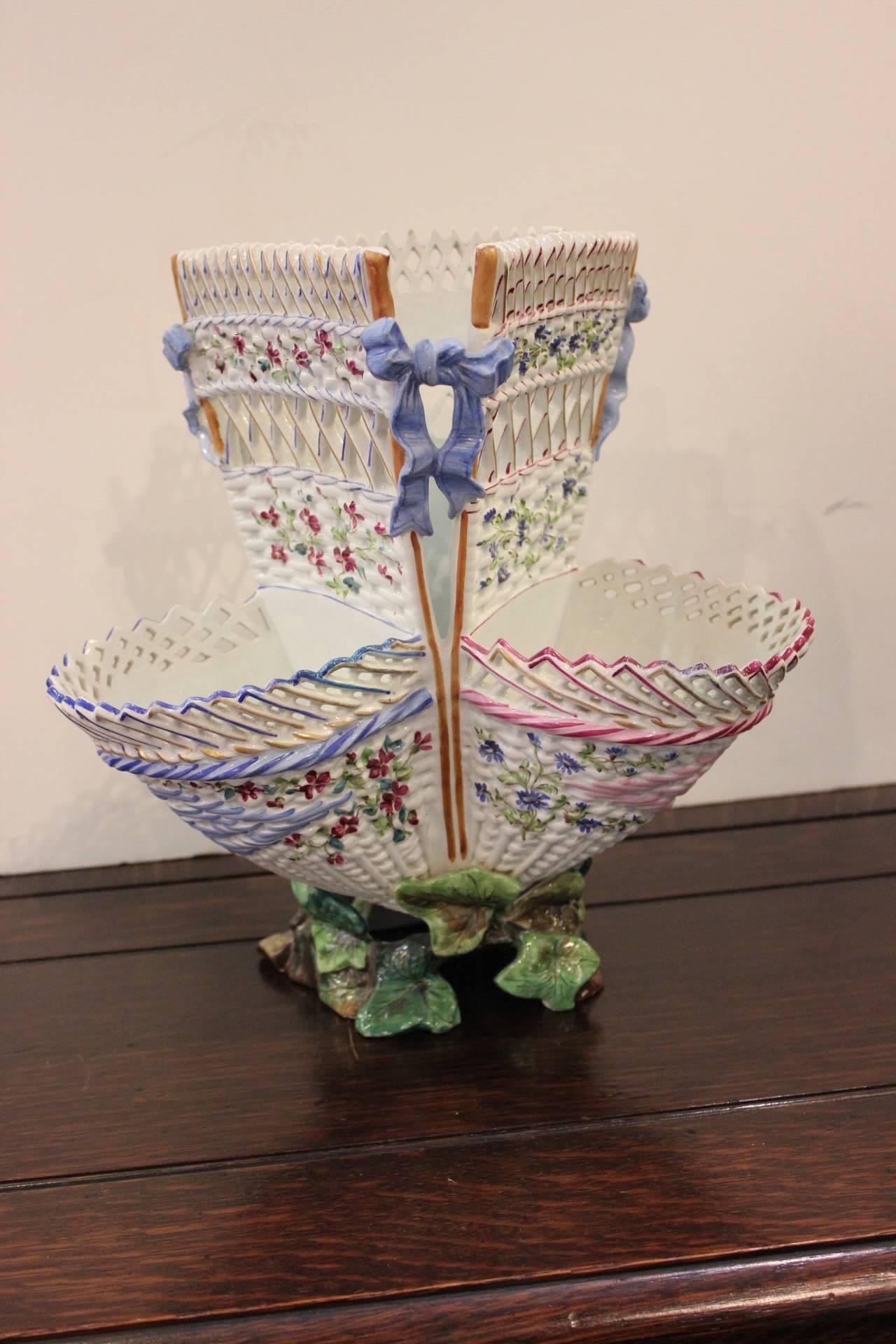 Delicate hand-painted French Faience basket form epergne. Marked Majorelle Nancy on bottom. Triple woven basket form with hand-painted decoration all around. The base is ivy leaves that surround and comprise the base. Majorelle is a famous French