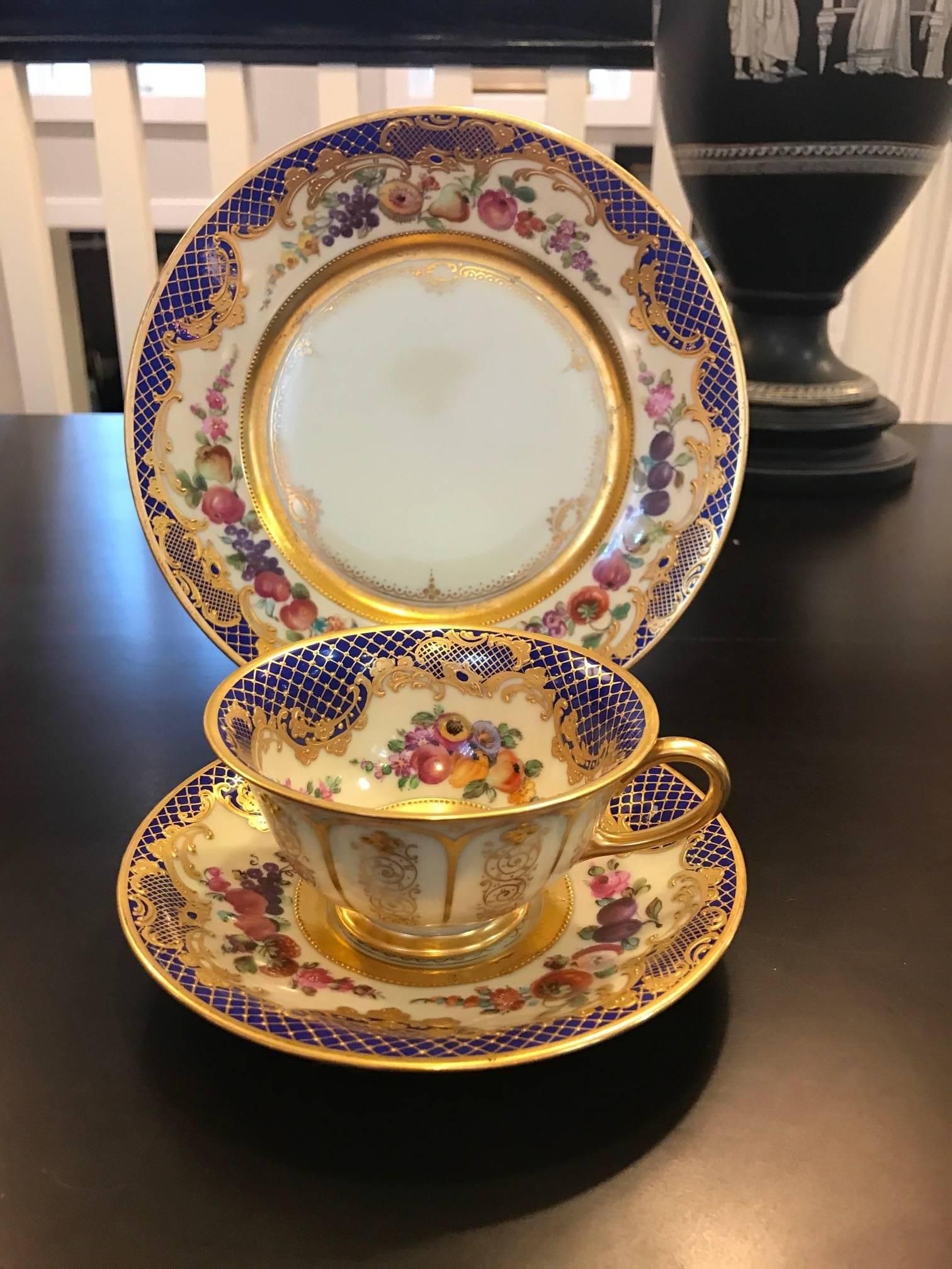A set of 11 tea cups and saucers and dessert plates with hand-painted and gilt decoration. Exceptional quality and highly skilled artistic detail. These are painted by the best artist available at the time, Ambrosius Lamm.
Has blue overglaze with