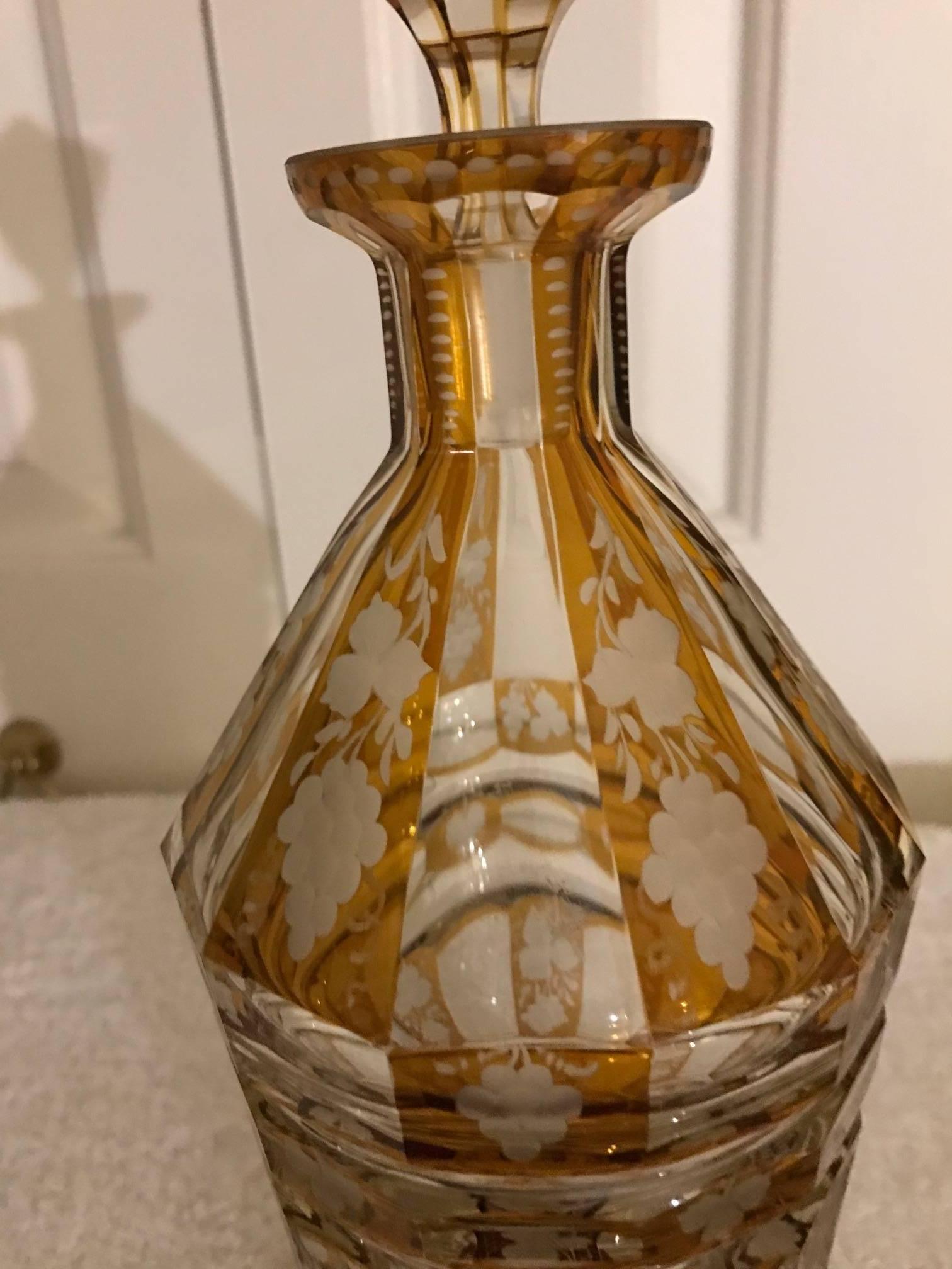 Elegant flat panel cut tapered decanter with intaglio cut grape pattern. The Citrine yellow overlay with engraved cutting to reveal the clear base glass. Original stopper in excellent condition