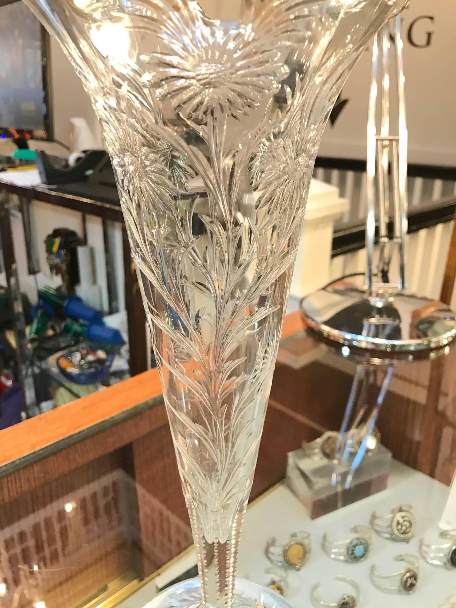 Elegant and formal intaglio cut-glass trumpet vase made by H. P. Sinclaire of New York. The handblown body is richly engraved with Art Nouveau style floral and leaf patters on the body and base. This pieces is signed with a very small acid stamp