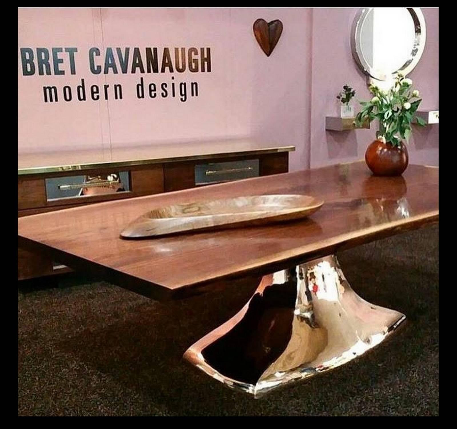 Called the "Bronze Lug" Hand-sculpted base is cast in bronze, then hand-polished to a mirror finish. Live edge black walnut slab top

Bret Cavanaugh is a modern craftsman and designer with a penchant for working with natural materials. A