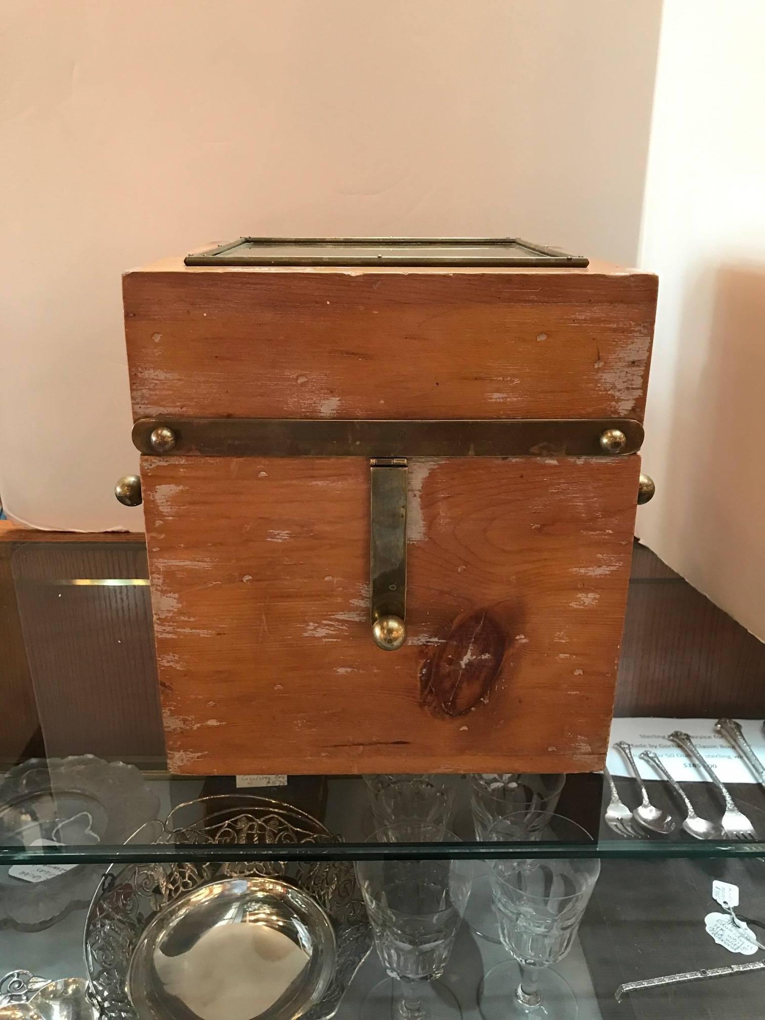 Very functional elmwood and brass four compartment spirits caddie. The wood box with metal top and brass handles with four handblown spirit decanters with brass stoppers.