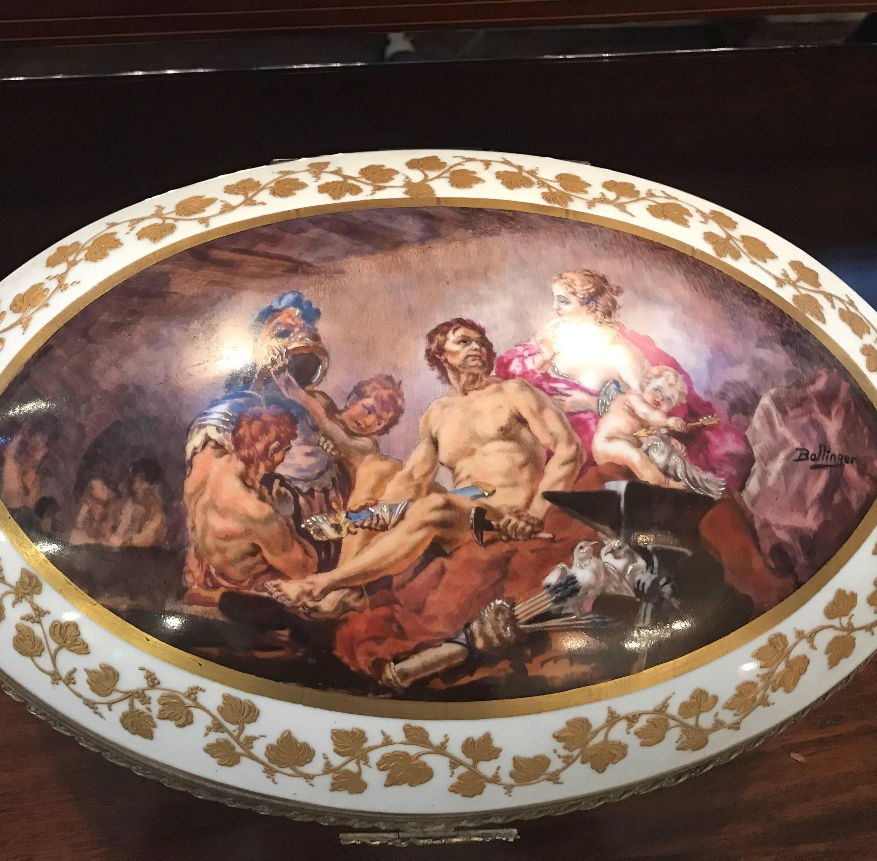 Beautiful antique French porcelain table box with gilt hinged mount. The allegorical painting on top artist signed Ballinger. The interior and along the outside is a raised impasto gilt leaf and vine decoration. On the interior lid is a love poem