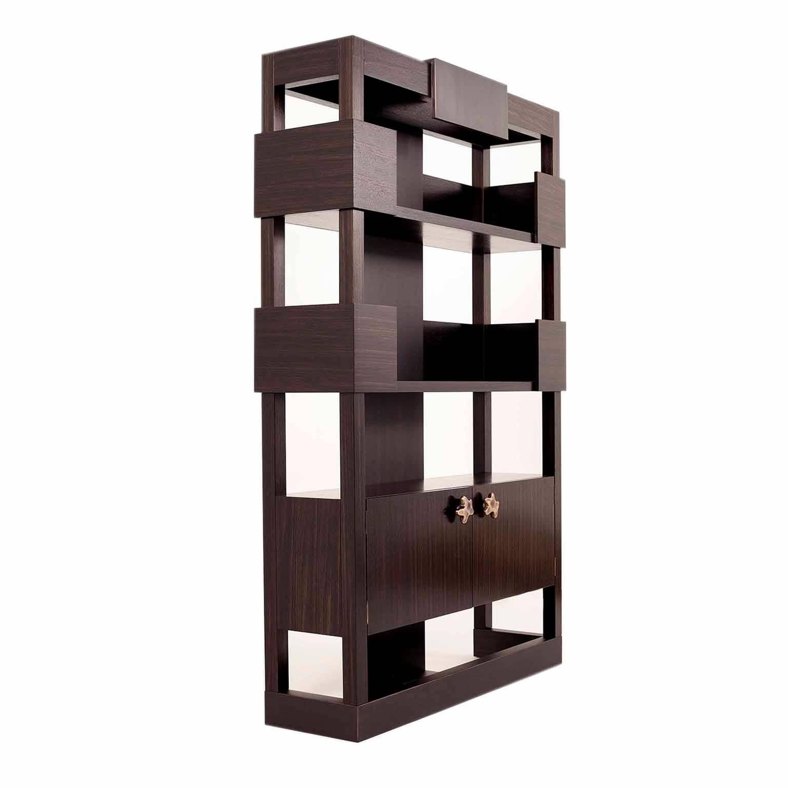 The strong geometry of this shelving unit replicates that of a Roman fort, creating a strong presence in any room, featuring a contrast in materials, textures and tones. The solid cast bronze have been specifically molded for this piece. This item