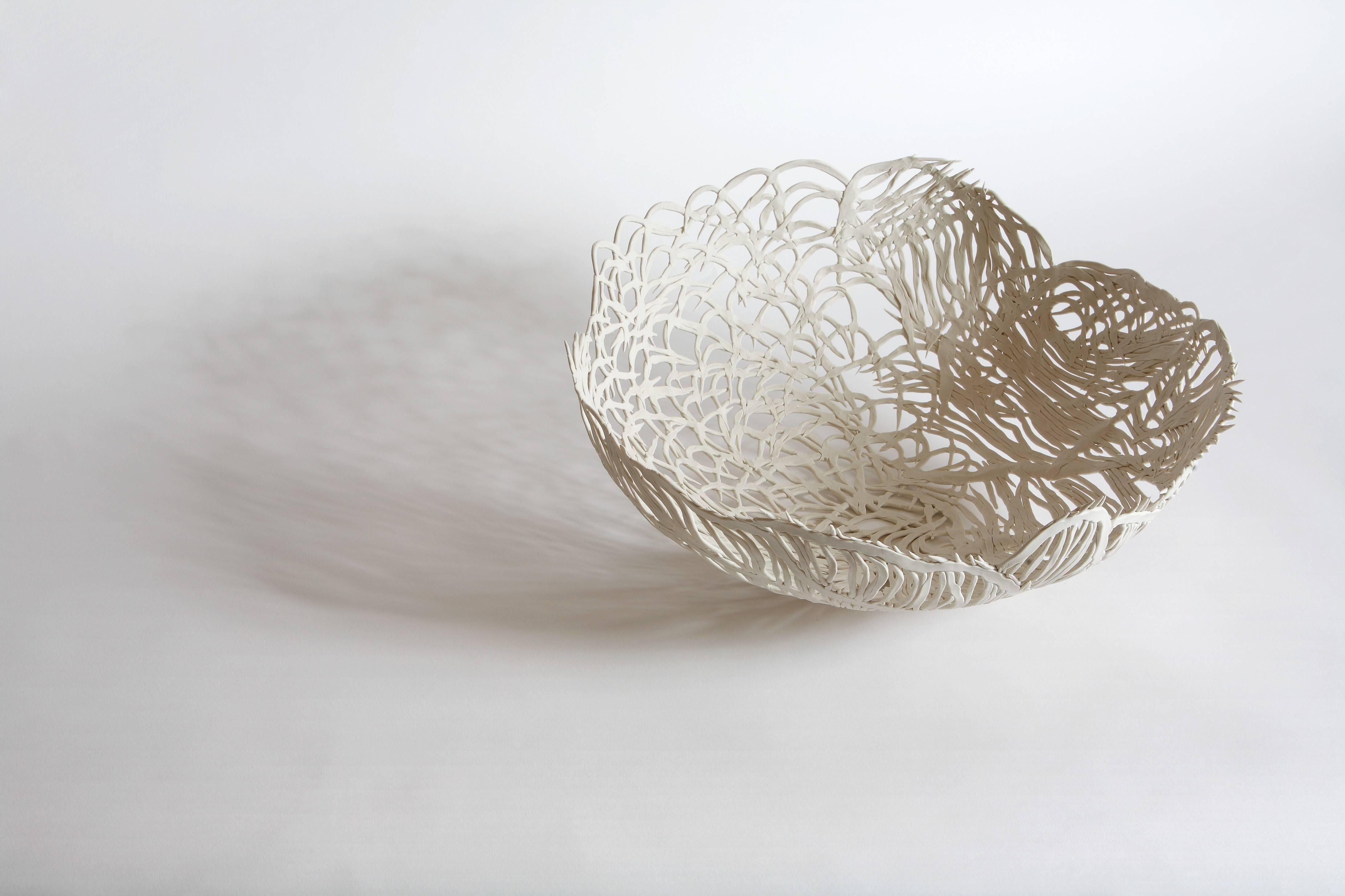 French artist Nathalie Derouet looks to play on light and translucency with the delicate handmade ceramic lace bowl. 

The inspiration behind these pieces are taken from Chinese and Japanese ceramics, countries where refinement and sophistication