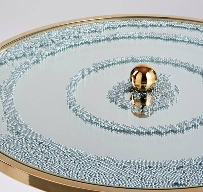 Coffee table in polished brass with magnets and mirror.
Signed and numbered.
(Available also with a black mirror).

Hubert le Gall was born in Lyon in 1961. After graduating in management, he decided to move to Paris in 1983. Five years later,