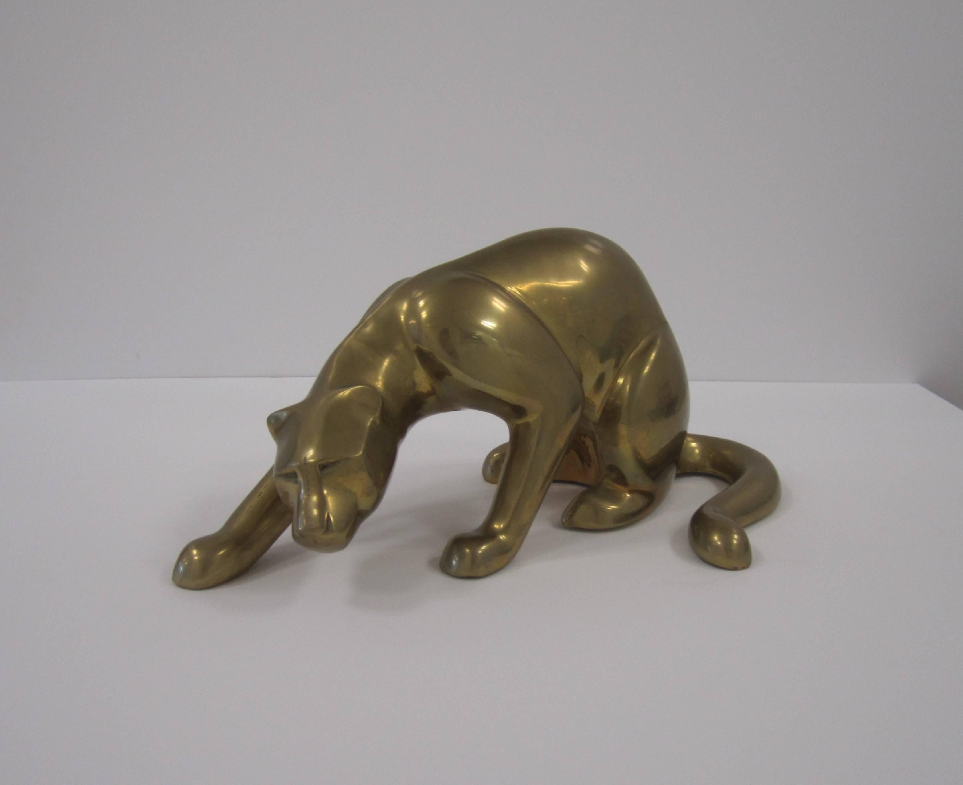A substantial vintage Art Deco panther cat sculpture cast in brass, circa 1970s.
Measurements include: 8